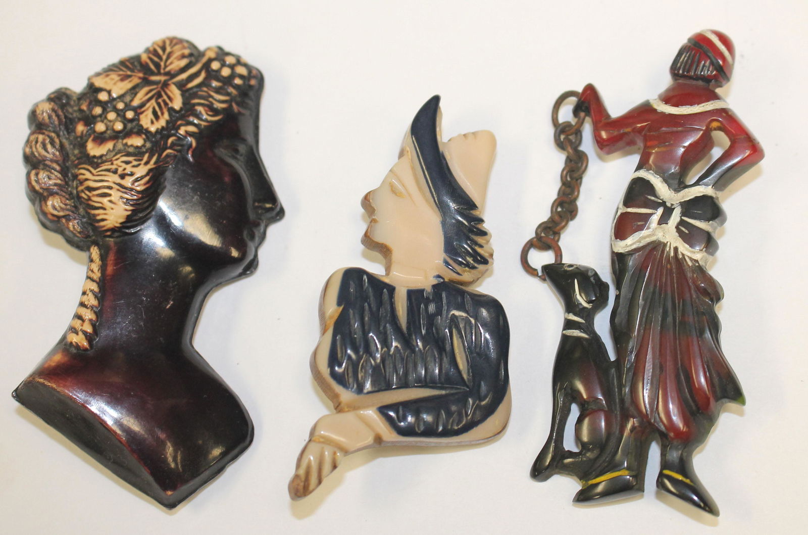 lot of 3 vintage Bakelite figural pins incl woman w dog (1 of 3)