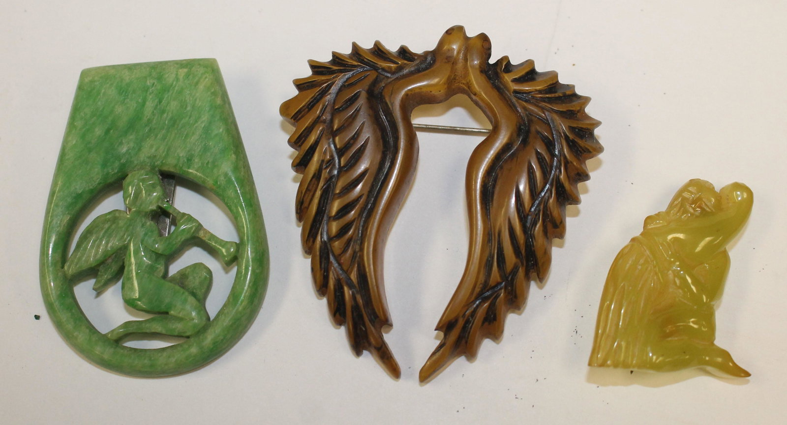 lot of 3 Vintage Bakelite pins & clips in angel & angel: lot of 3 Vintage Bakelite pins & clips in angel & angel wing motif - 2 1/4", 2" & 1 1/2"