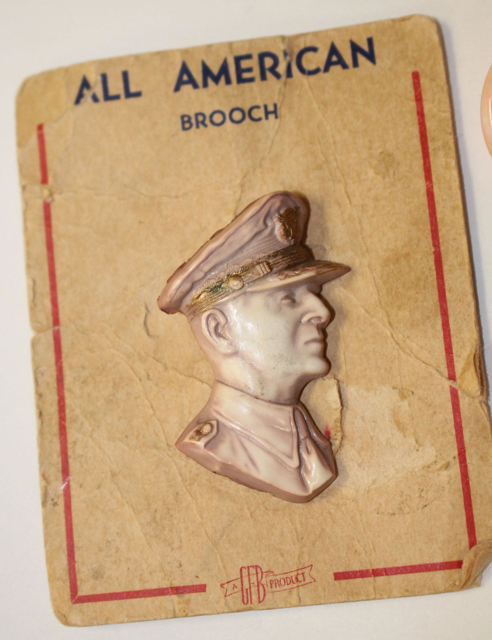 Vintage Celluloid figural brooch of military man (1 of 1)