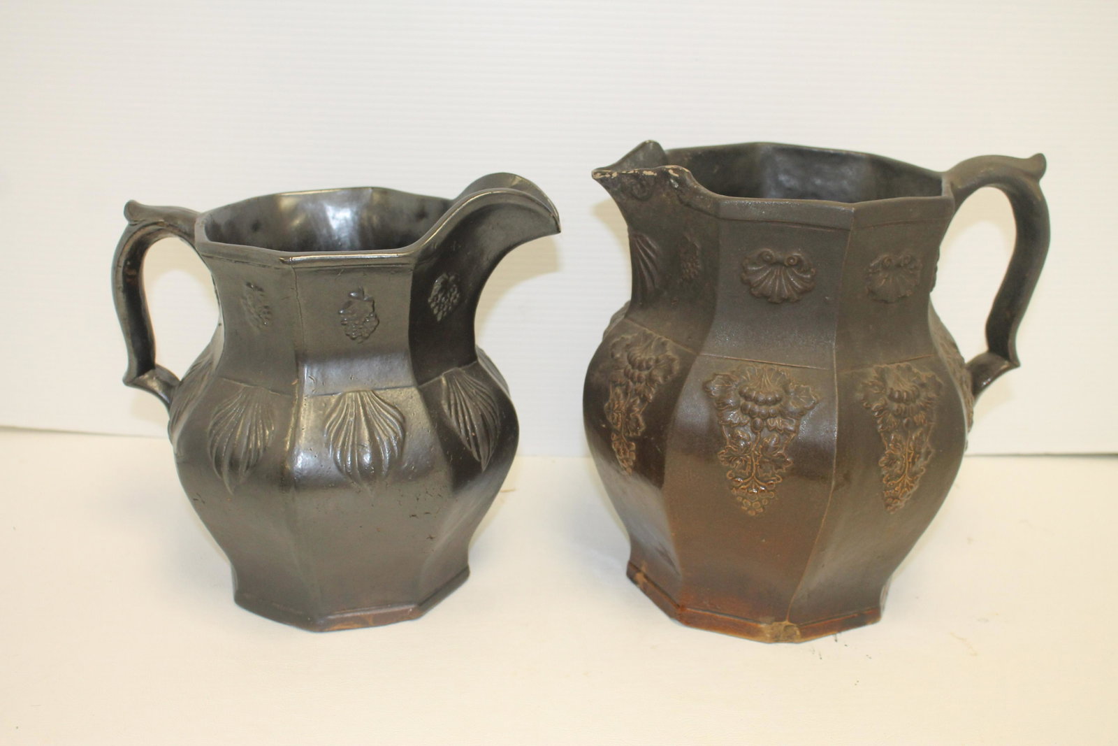 2 Sidney Risley Rockingham pitchers - 1 stamped - 1 as: 2 Sidney Risley Rockingham pitchers - 1 stamped - 1 as is w lip damage - 9" & 9 3/4" tall