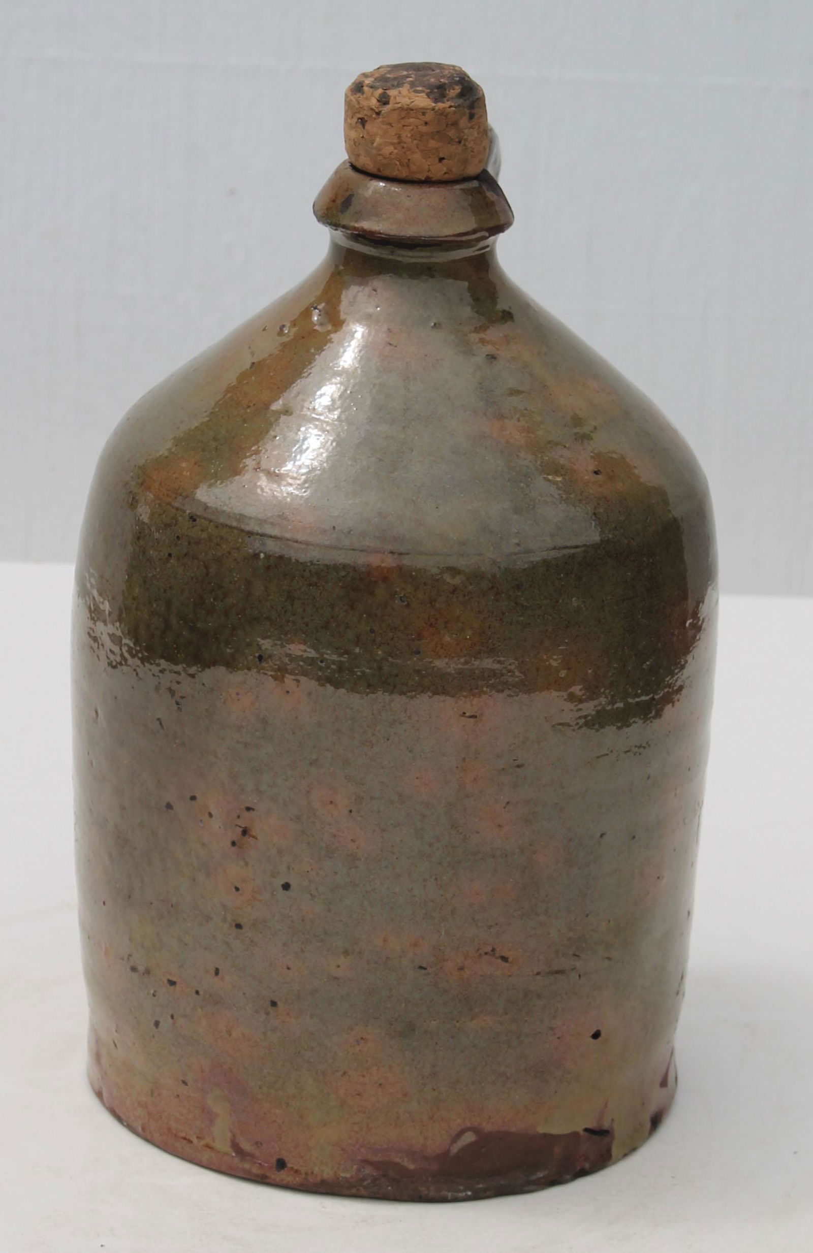 Antique redware jug in green glaze w corked top - 8: Antique redware jug in green glaze w corked top - 8 3/4" tall