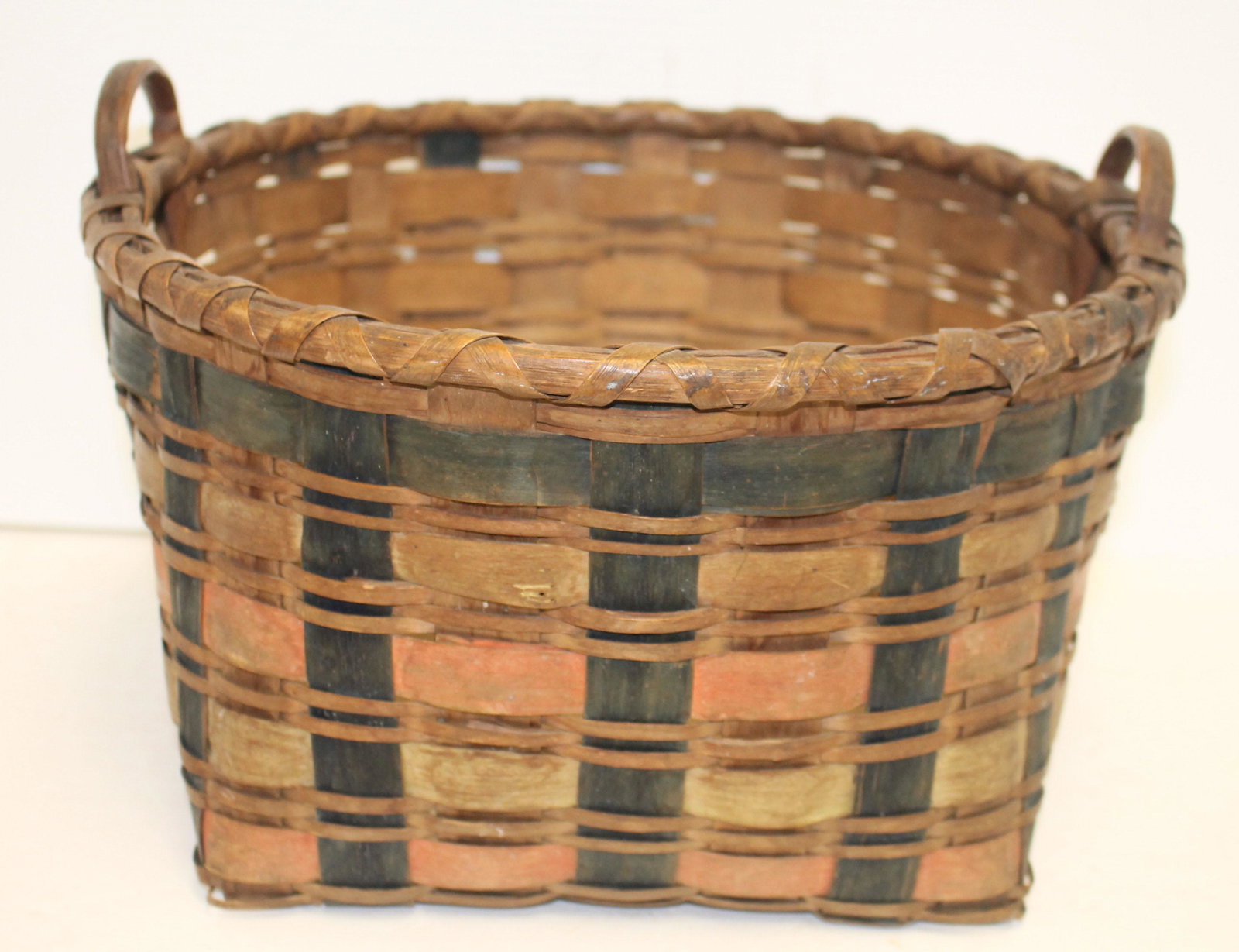 Antique Native American multi colored dbl handled: Antique Native American multi colored dbl handled basket - 13" diam x 9" tall to top of handle