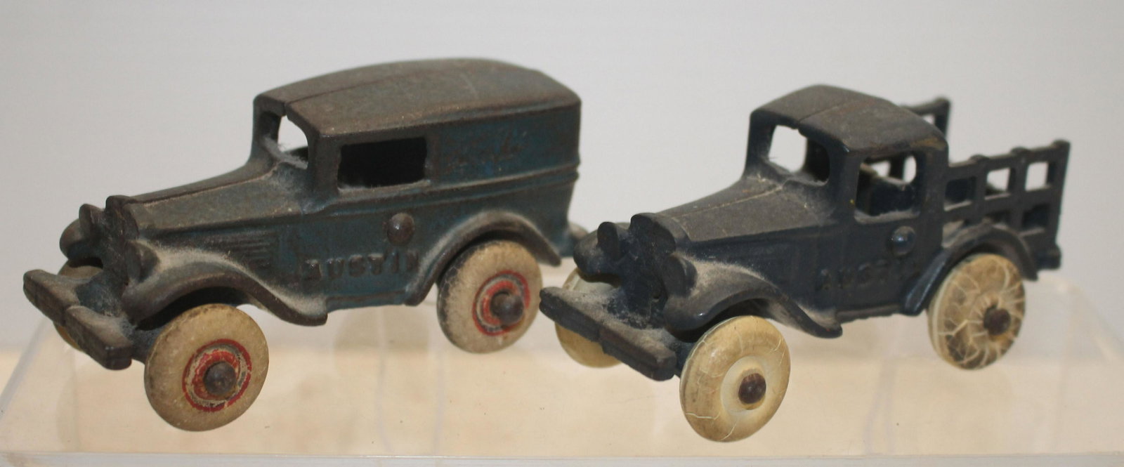 2 cast iron attrib Arcade "Austin" vehicles - delivery: 2 cast iron attrib Arcade "Austin" vehicles - delivery truck & stake truck - 3 3/4" long