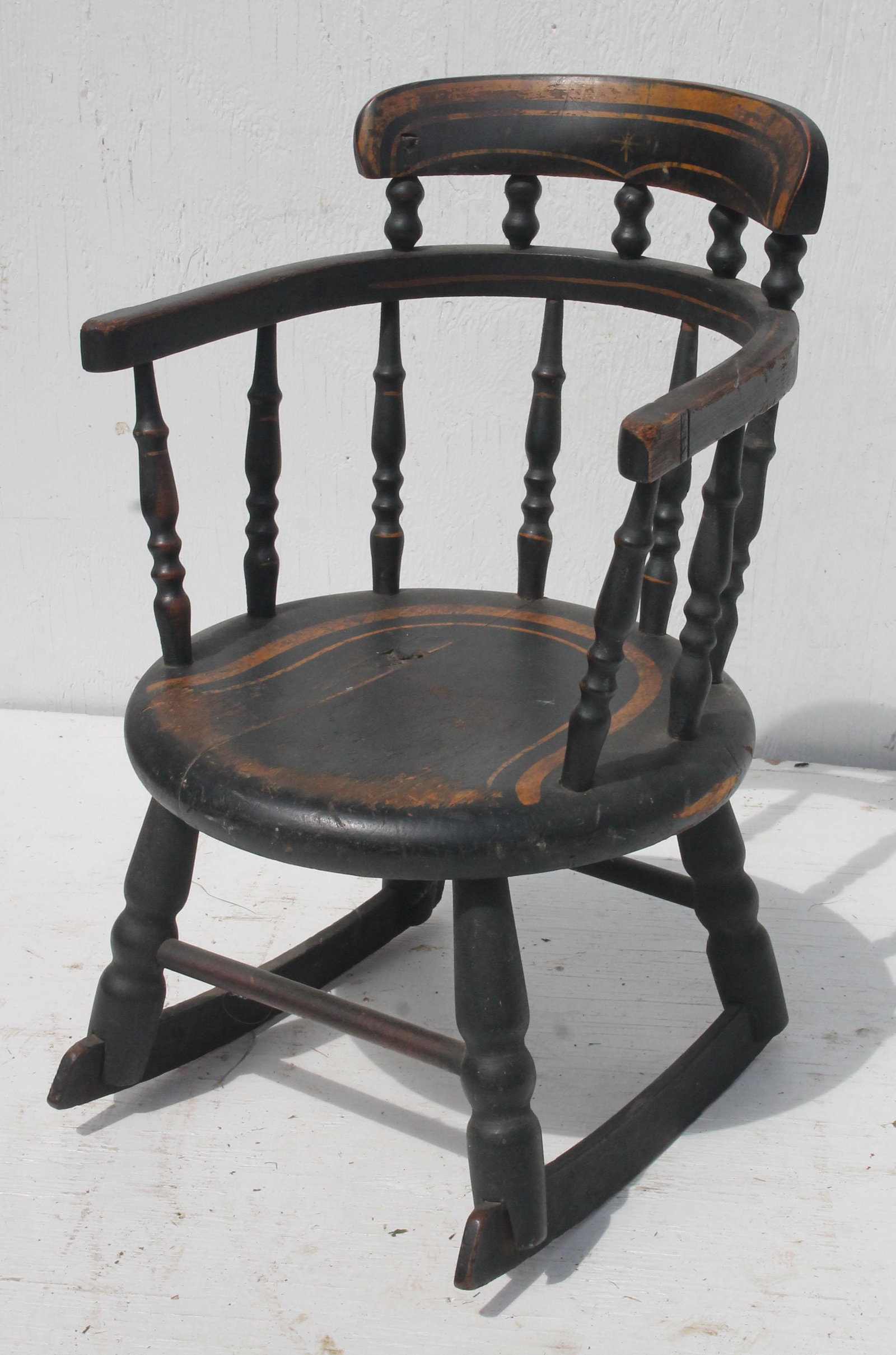 Antique Windsor child's rocker in black & gold paint -: Antique Windsor child's rocker in black & gold paint - 19 1/2" tall