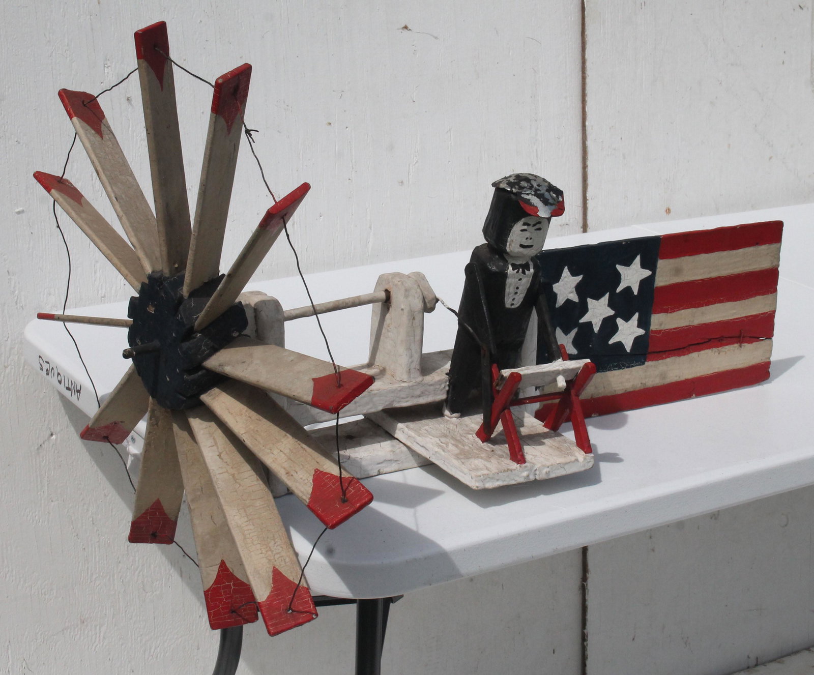 late 19thC whirligig - descended in family of GH Boss: late 19thC whirligig - descended in family of GH Boss New london, CT - some orig paint & some retouched - 27" long x 20" diam wheel