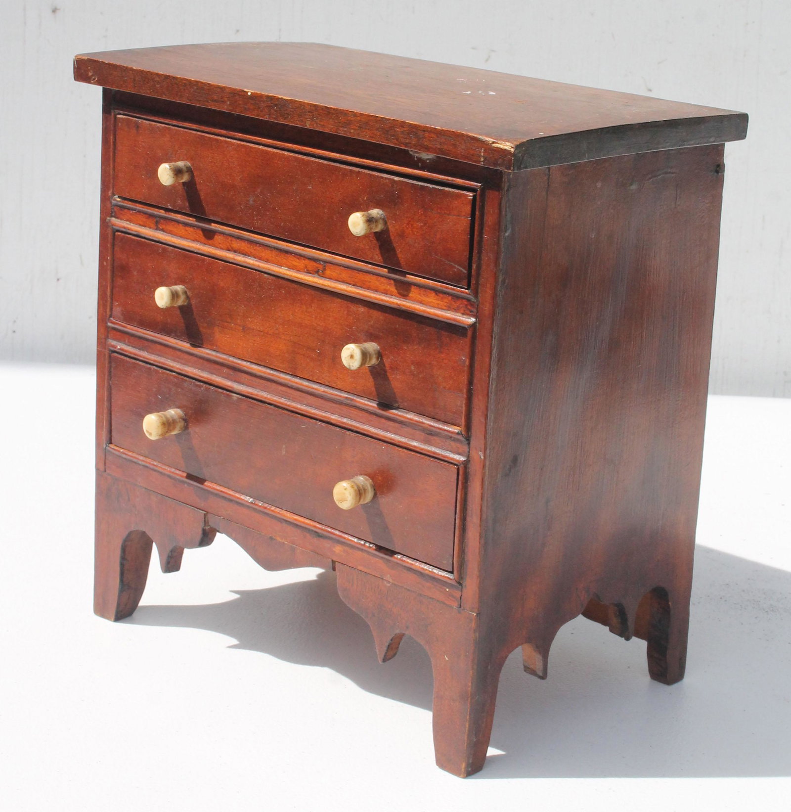 Antique miniature 3 drawer chest w fancy cut out base &: Antique miniature 3 drawer chest w fancy cut out base & bone knobs - 10" tall x 9 3/4" wide x 6" deep