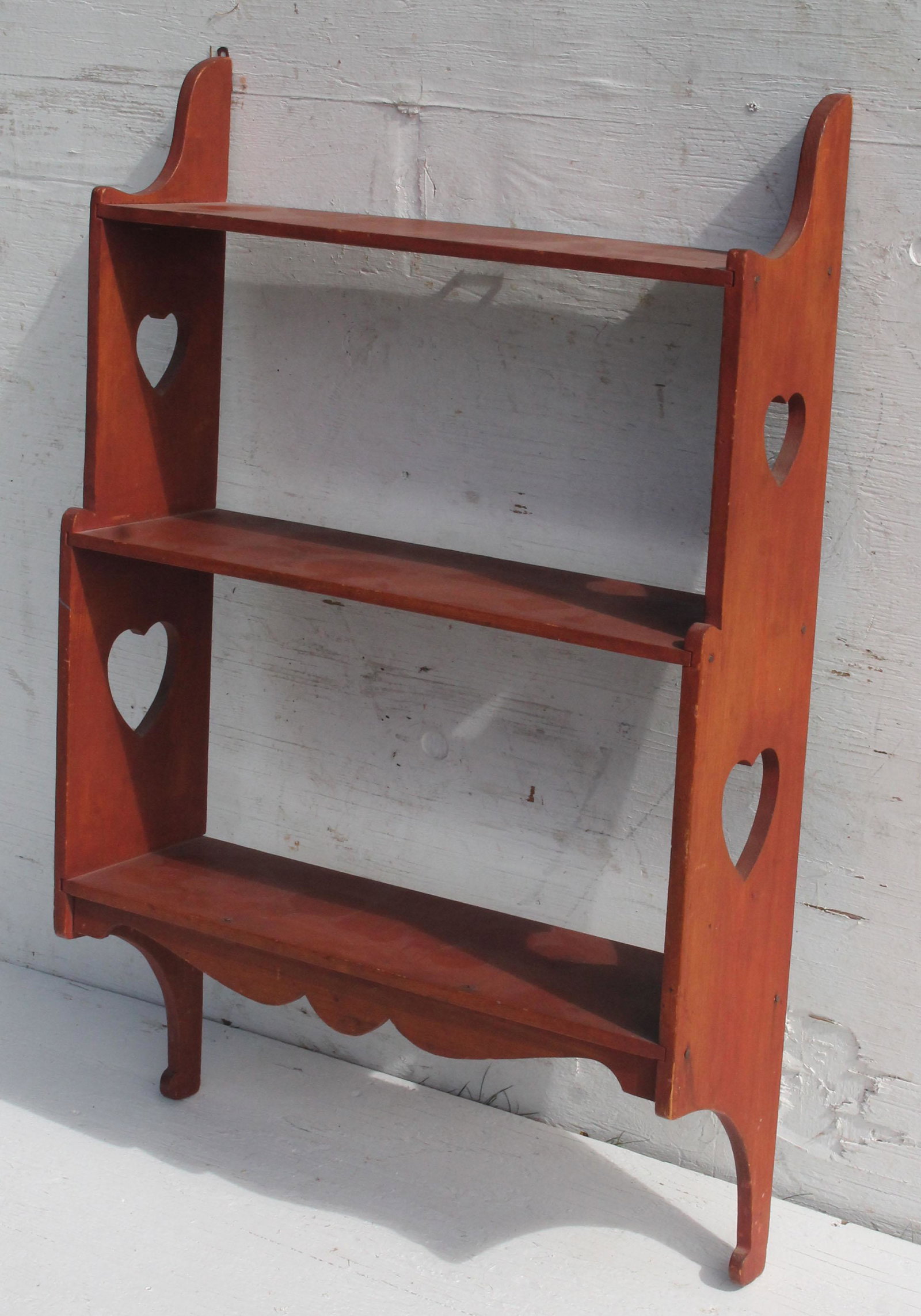 Antique hanging shelf in red paint w heart profile cut: Antique hanging shelf in red paint w heart profile cut outs - 31" tall x 20" wide x 6" deep