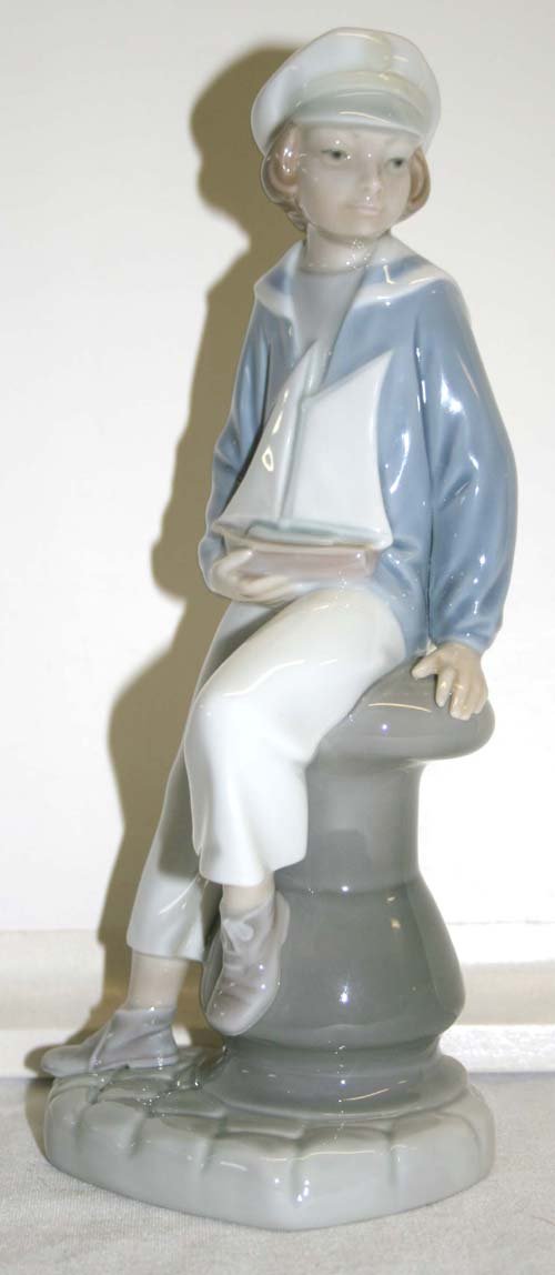Lladro porcelain figurine boy w sailboat - 9" tall
