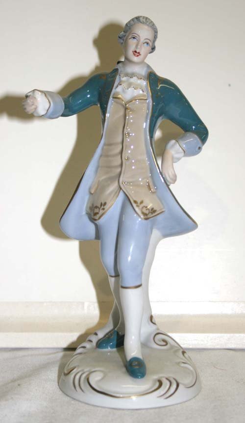 Royal Dux porcelain figurine of a female w flowing: Royal Dux porcelain figurine of a female w flowing cobalt blue dress - 9 1/2" tall