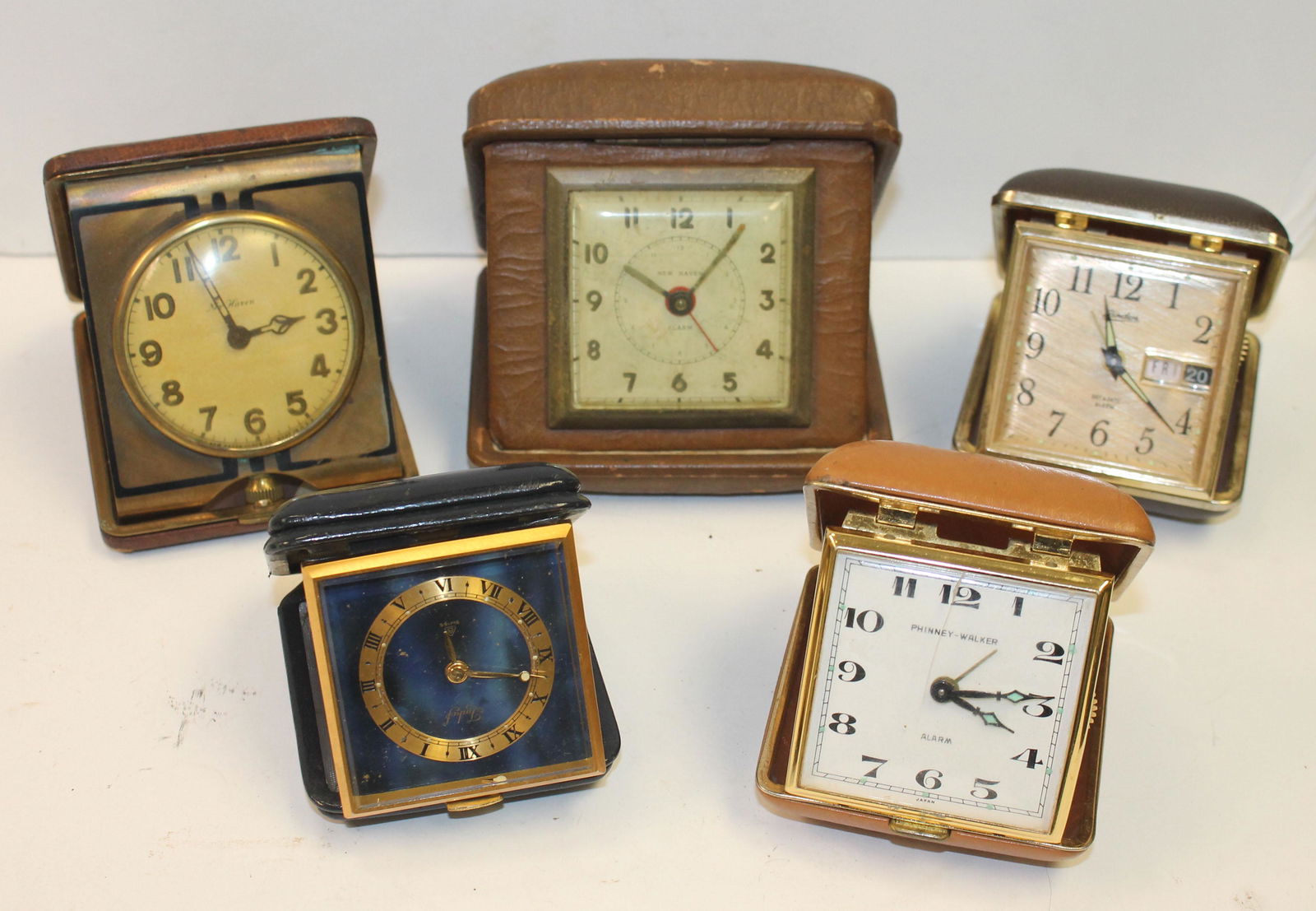 lot of 5 travel alarm clocks in cases by New Haven, (1 of 7)