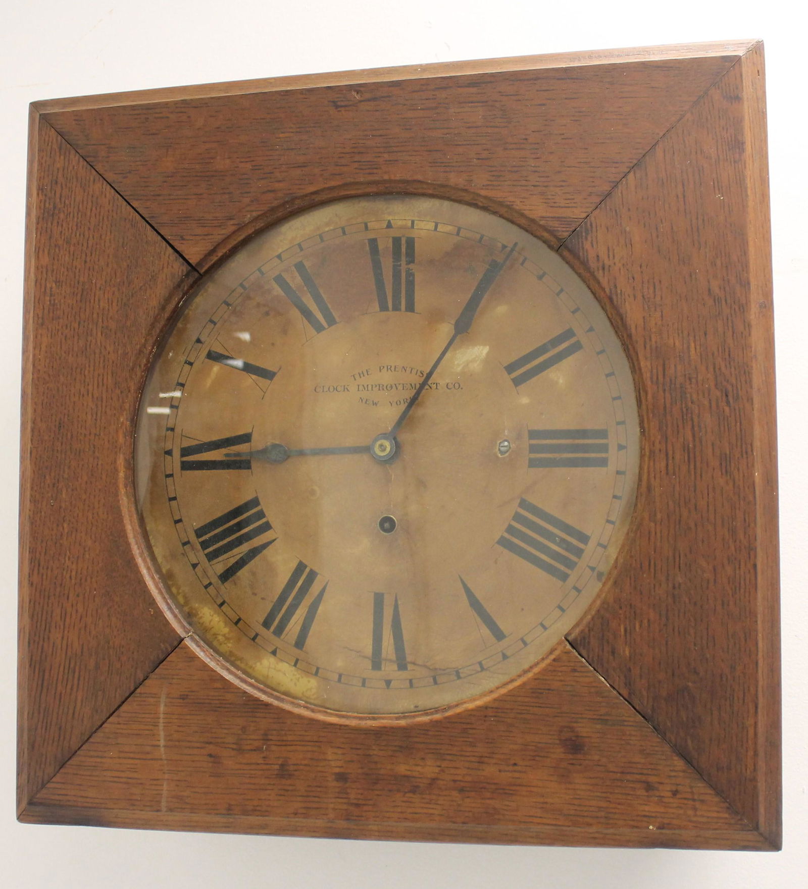 The Prentiss Clock Improvement Co square oak wall clock (1 of 2)