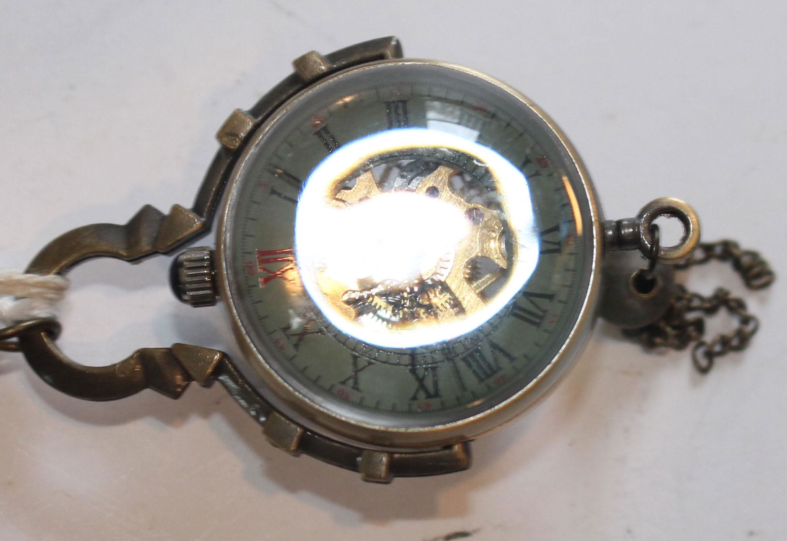 Antique skeleton clock on chain (1 of 3)