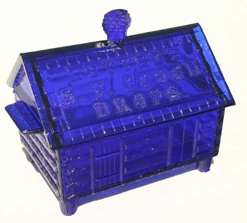 "Lutted's S.P. Cough Drops" cobalt blue glass log : "Lutted's S.P. Cough Drops" cobalt blue glass log cabin form covered store display