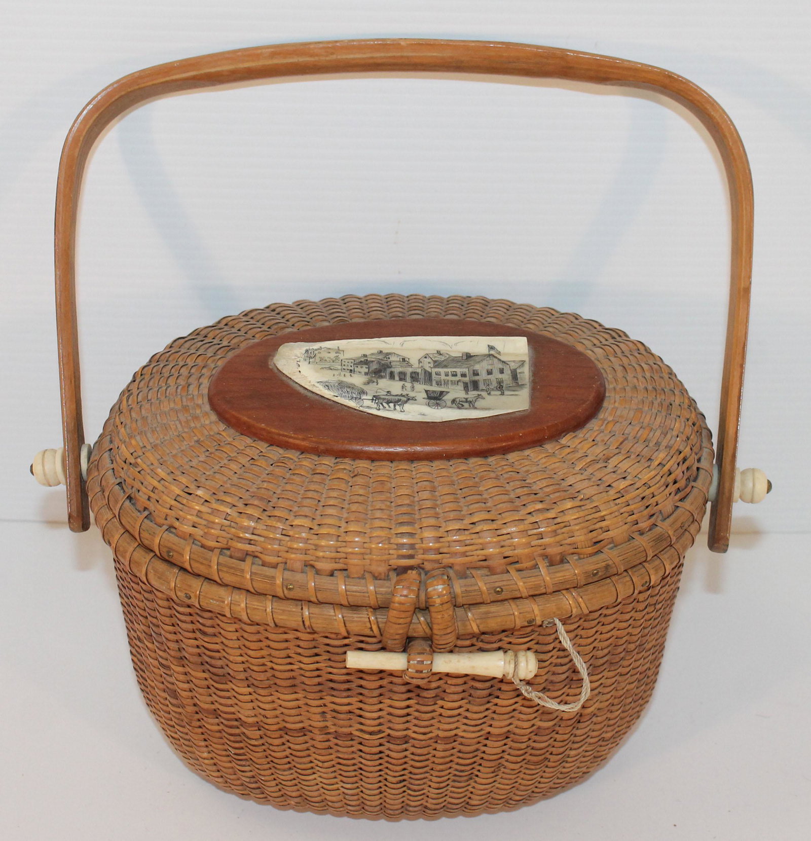 Contemporary Nantucket swing handle basket w bone: Contemporary Nantucket swing handle basket w bone etched scenic plaque on lid, bone escutcheons on handles & bone feet - 8 3/4"x7 1/2" x 6 1/2" tall