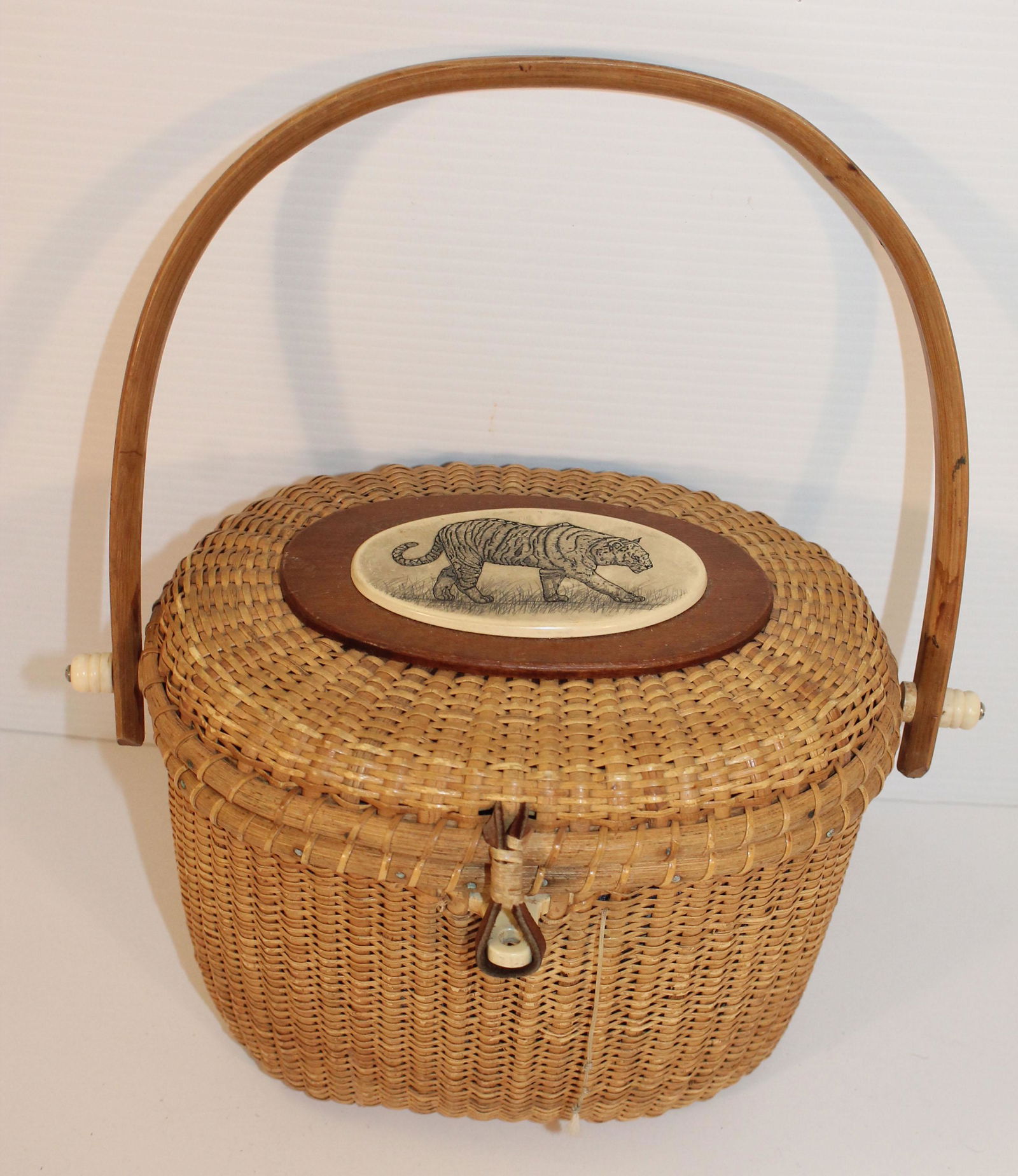 Contemporary Nantucket swing handled basket w bone: Contemporary Nantucket swing handled basket w bone plaque w etched tiger on lid & floral fabric lined interior - sgnd Barlow - missing bone peg to latch - 9"x7"x 6 1/2" tall