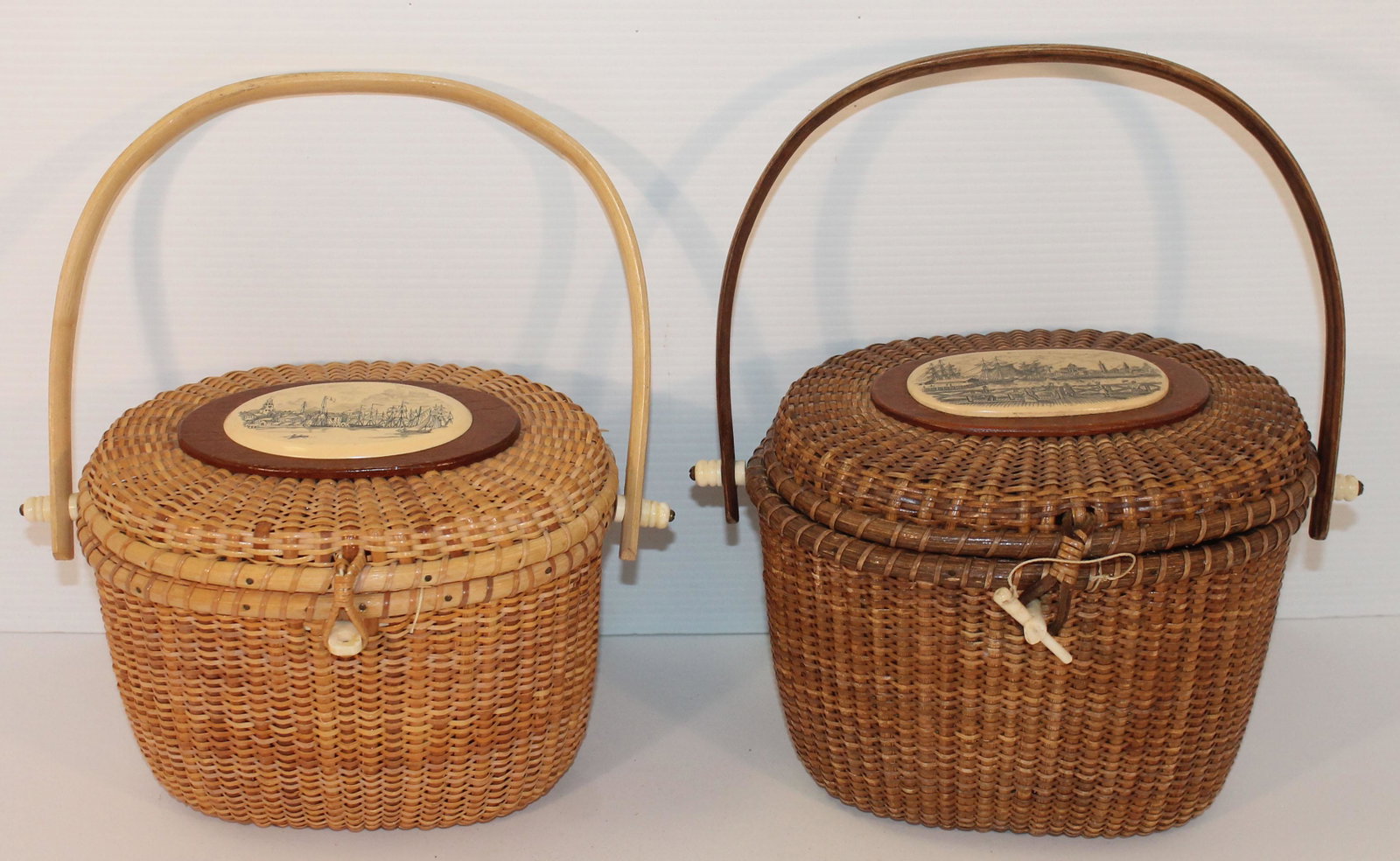 2 Farnum contemporary Nantucket swing handled baskets w: 3 Farnum contemporary Nantucket swing handled baskets w etched bone scenic plaques on lid & etched scenic plaque on lid interior of one & carved bone whale on interior of the other - approx 9"x7 1/2" 