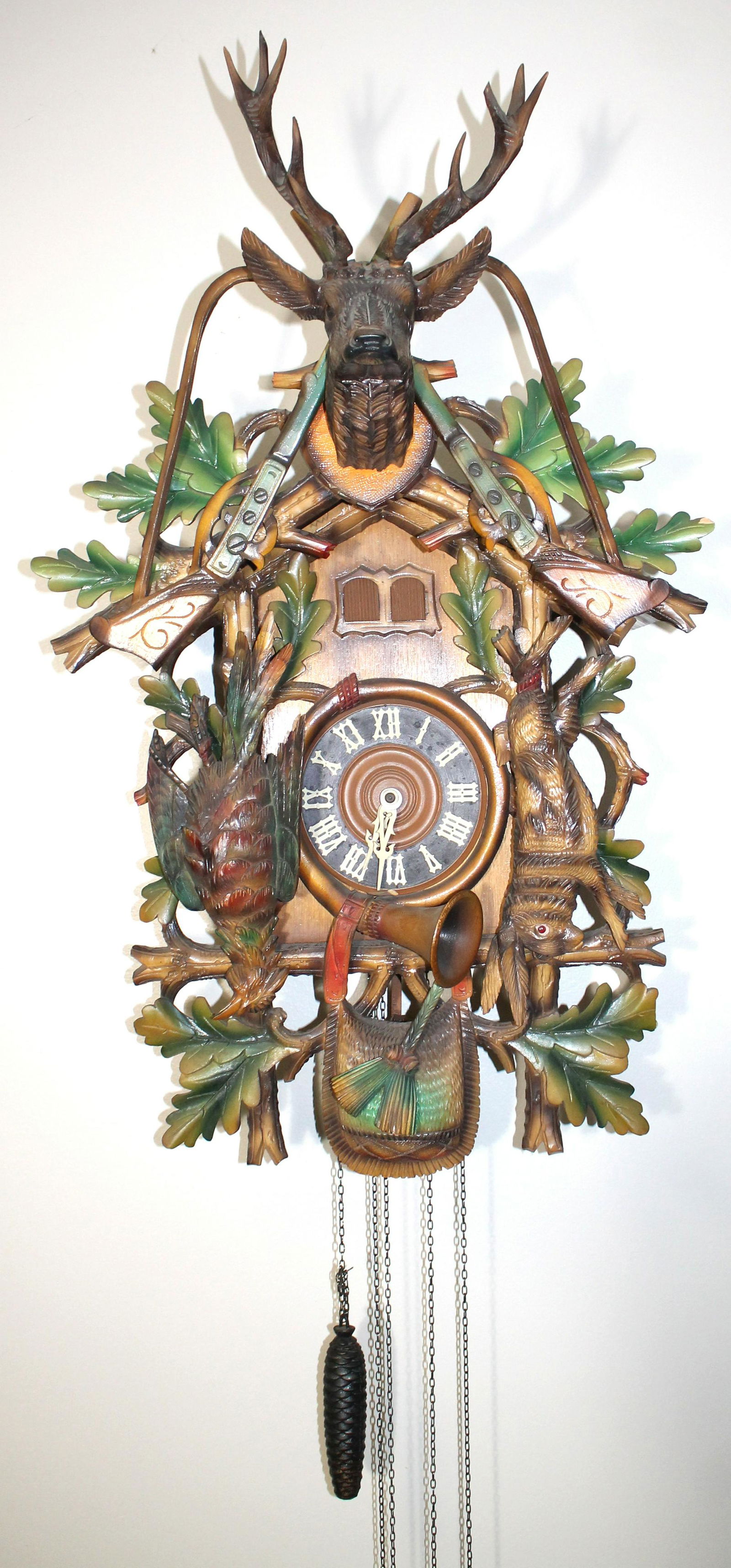 Black Forest cuckoo clock w carved deer head, guns, (1 of 16)
