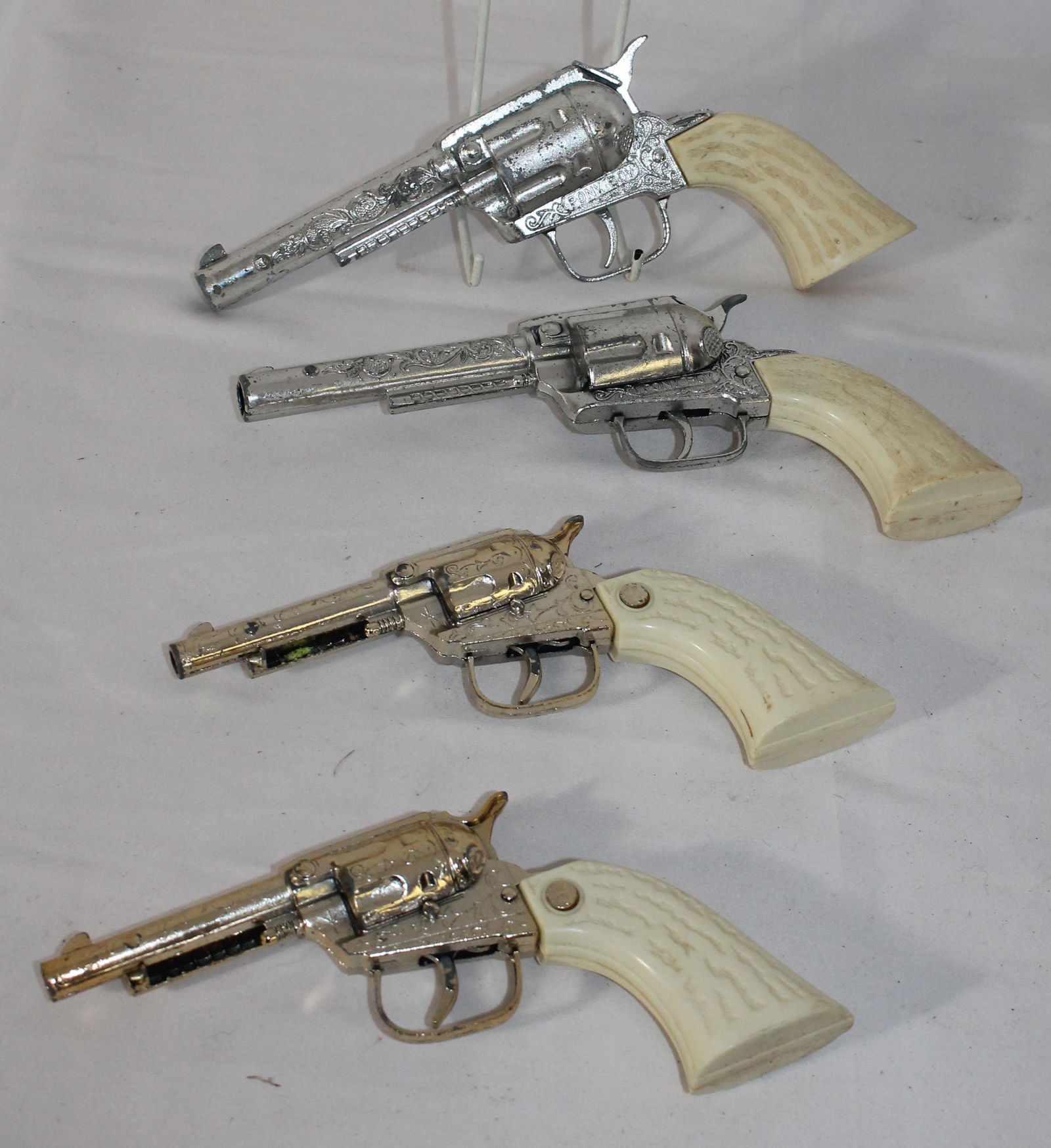 4 toy cap guns - 2 marked "Pony Boy" - 7 1/2"-9 1/2" (1 of 5)
