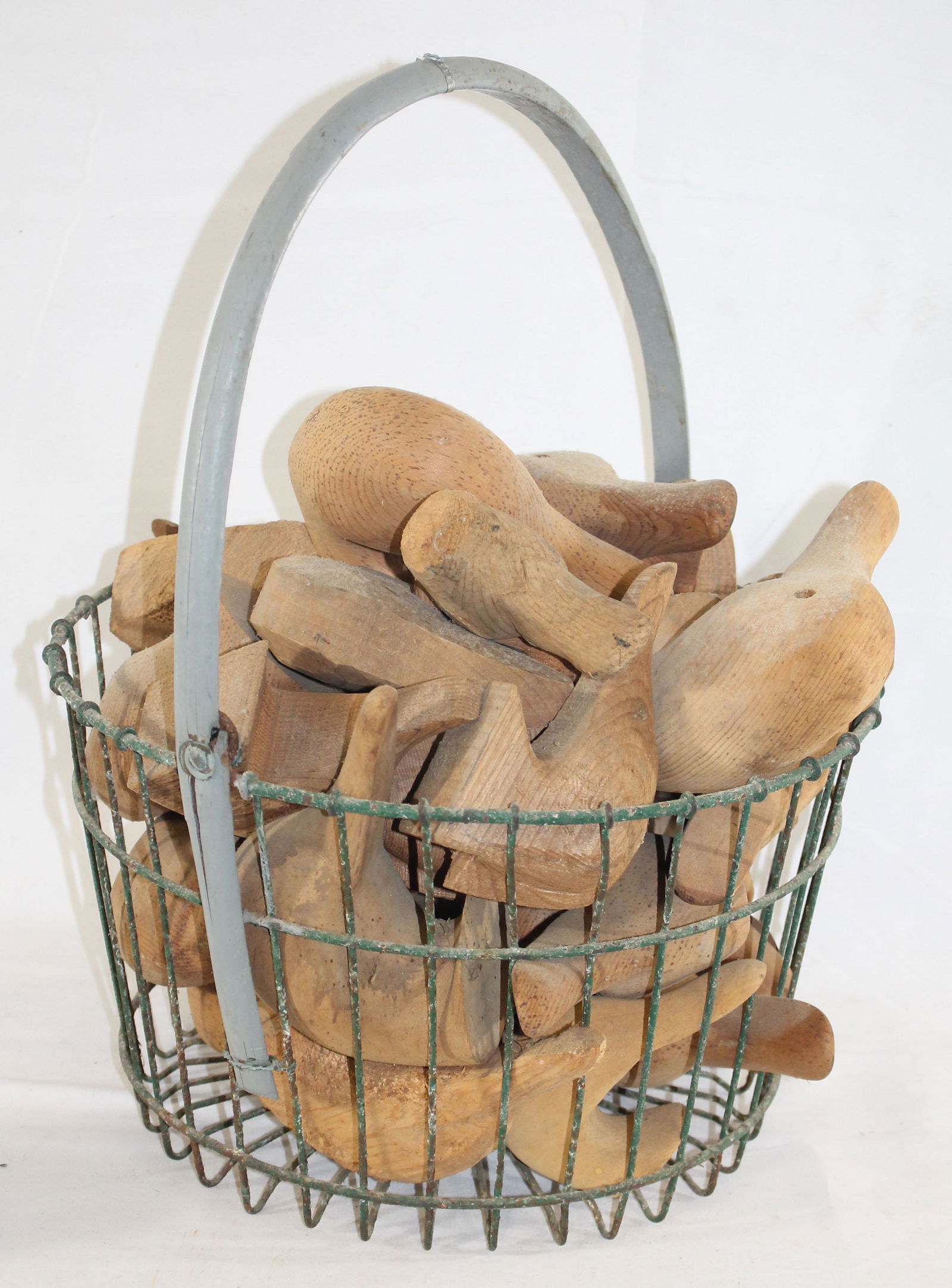 Wire clam basket filled w wooden duck decoy heads - (1 of 3)