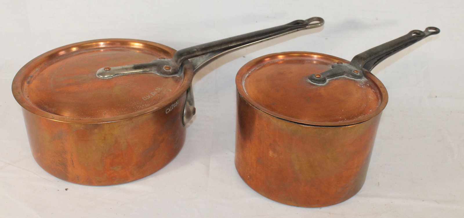 2 large copper covered pots w iron handles - marked (1 of 5)