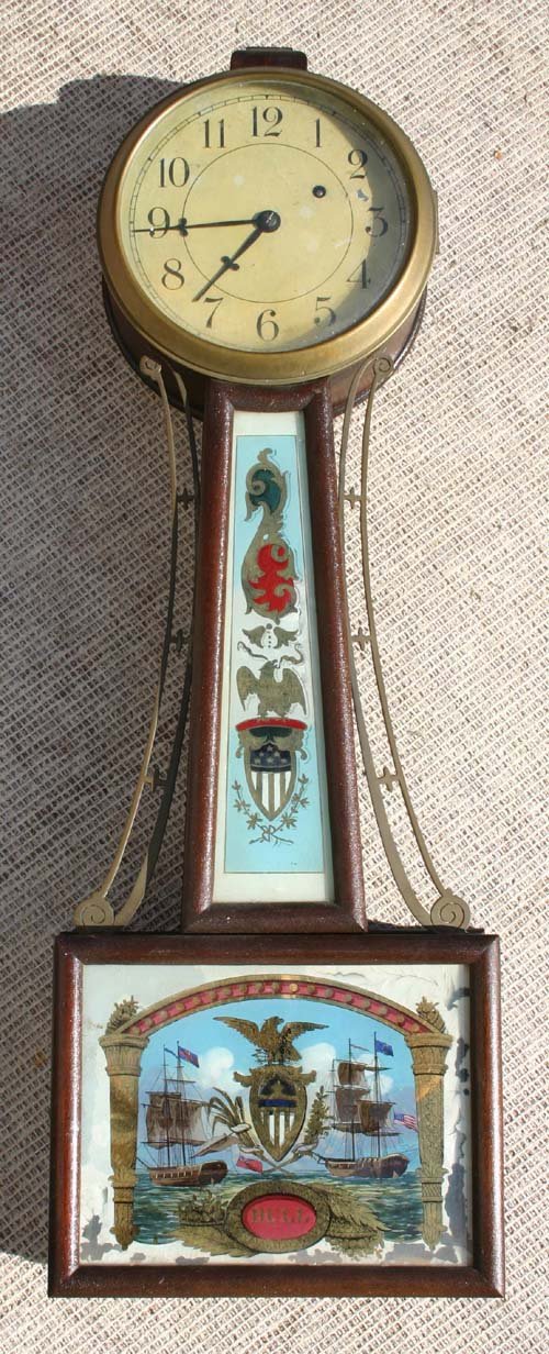 antique Willard patent banjo clock by Herscheides : antique Willard patent banjo clock by Herscheides w great rev ptd panel of British & Amer ships marked "Hull" - 31" tall (missing base cap)