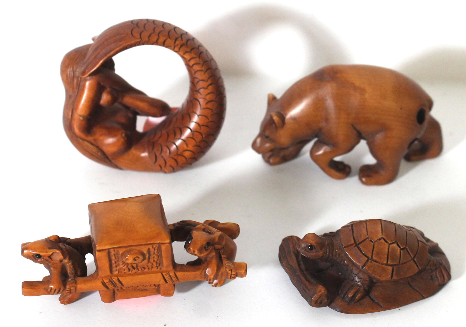 4 Japanese carved wooden netsukes - mice carrying a: 4 Japanese carved wooden netsukes - mice carrying a carriage, turtle, bear & mermaid
