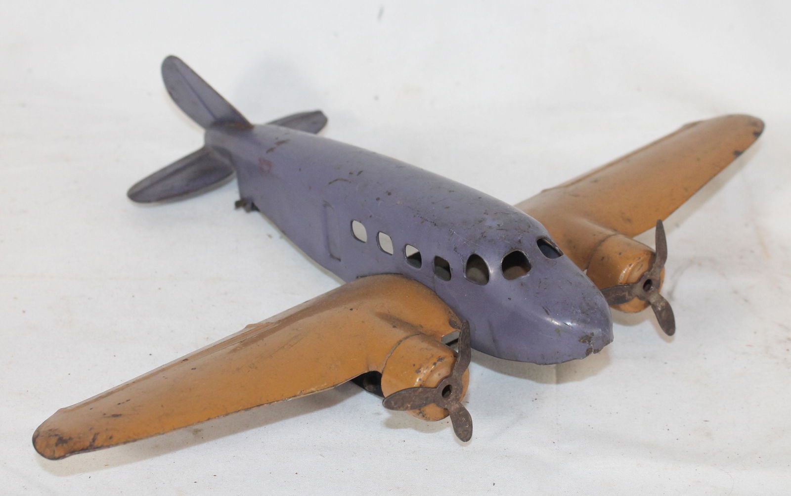 Pressed steel airplane w 2 propellers - 13" wide x9" (1 of 3)