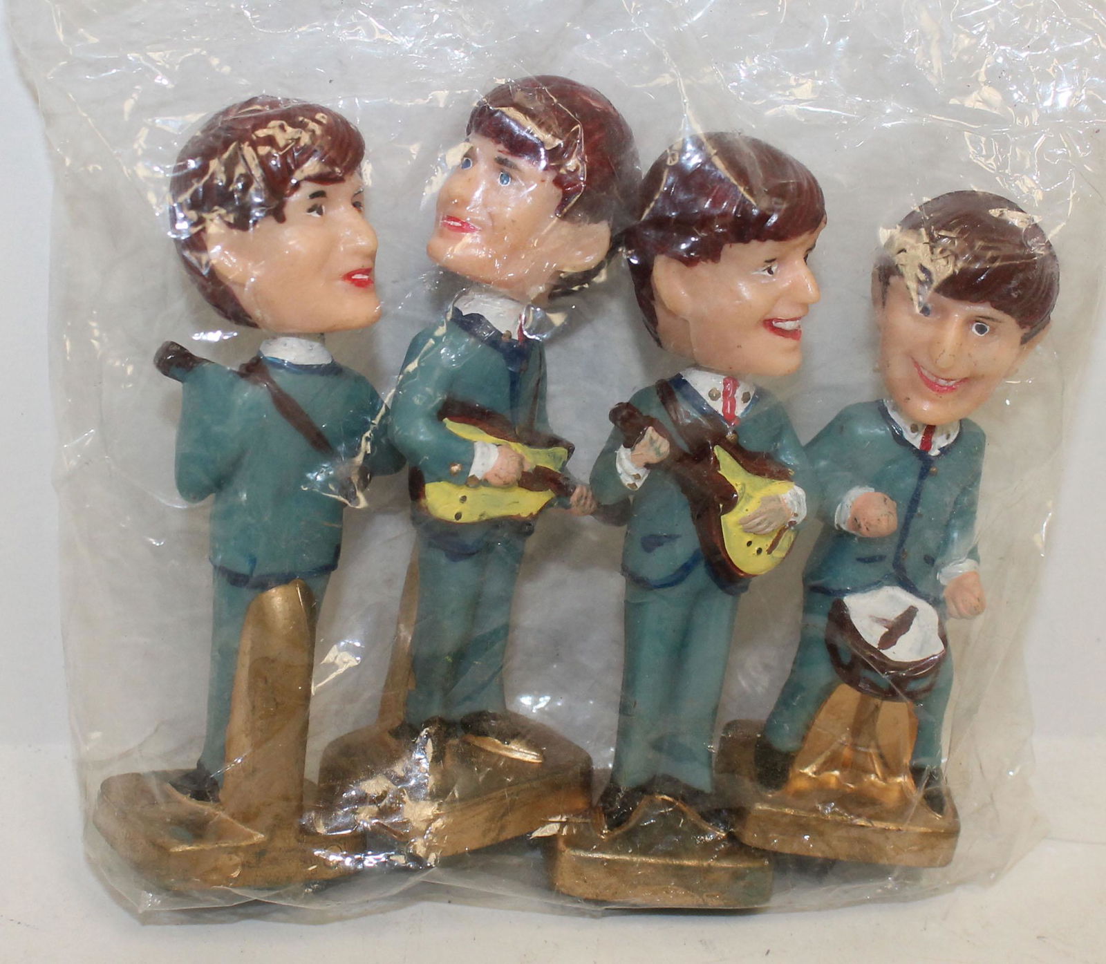 Vintage set of 4 Beatles bobble head plastic figures in (1 of 6)