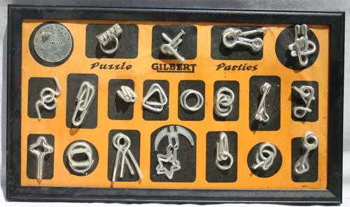 orig display Gilbert metal puzzle display board: orig display Gilbert metal puzzle display board
