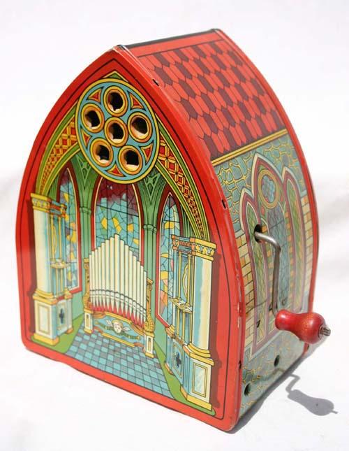 Chein tin crank handled Cathedral organ - 9 1/2" t: Chein tin crank handled Cathedral organ - 9 1/2" tall