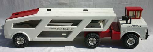 "Mighty Tonka" very large pressed steel car carrie: "Mighty Tonka" very large pressed steel car carrier in red & white - 35" long