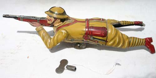 Marx tin wind up Army soldier shooter on belly - 7: Marx tin wind up Army soldier shooter on belly - 7 1/2" long