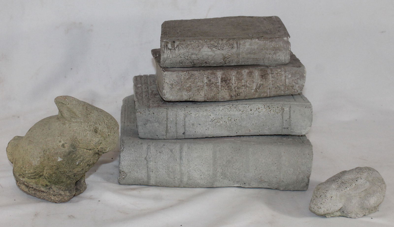 lot of cement garden decorations incl a stack of books (1 of 6)