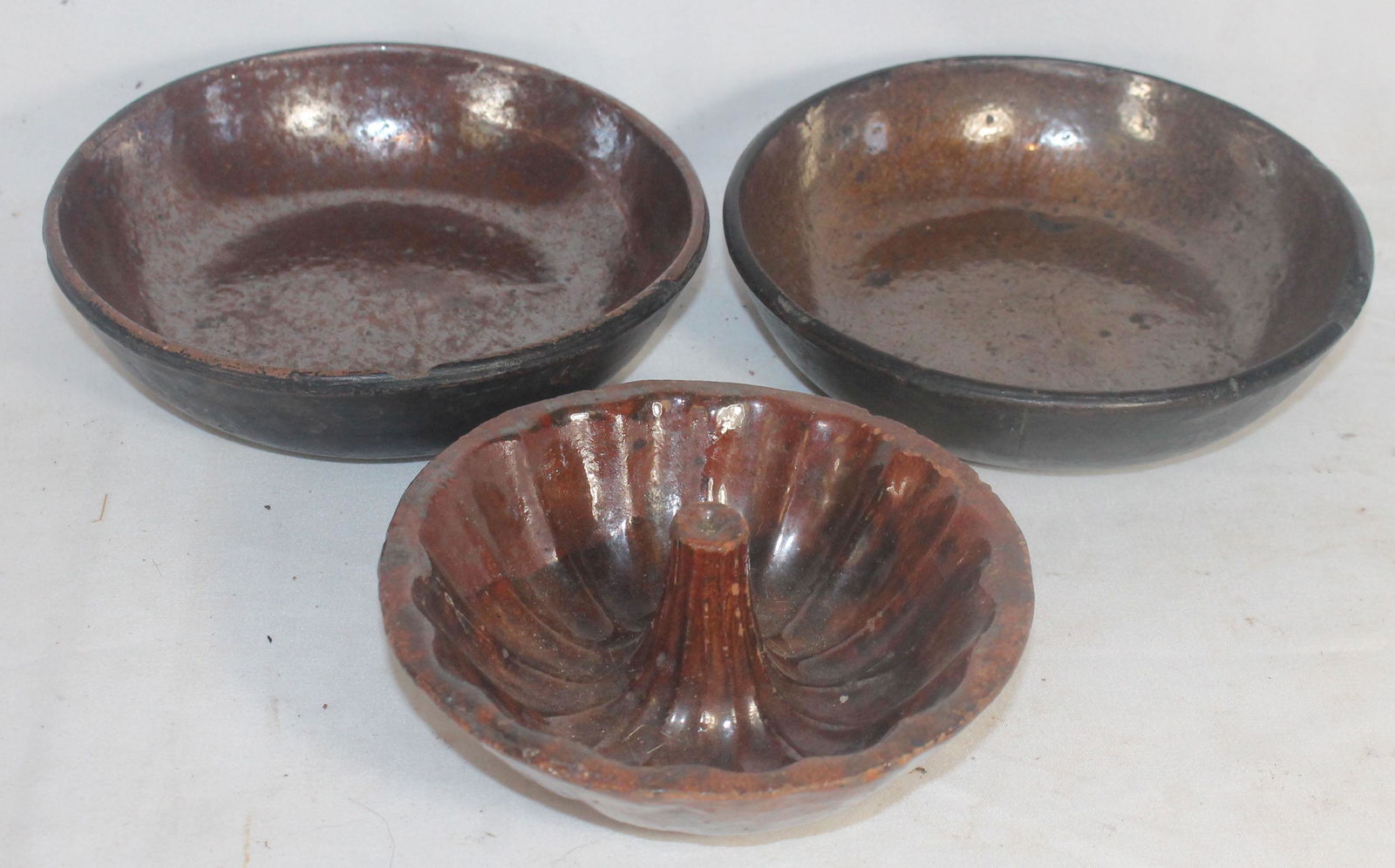 2 small redware shallow bowls together w a redware (1 of 9)