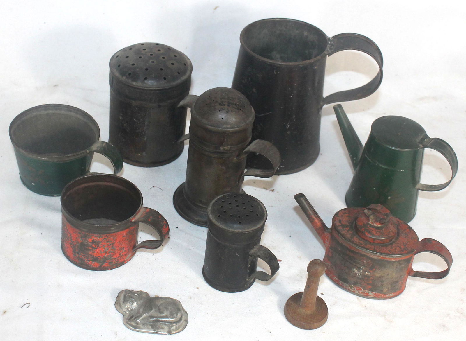 Collection of early tin shakers, some w remnants of (1 of 5)