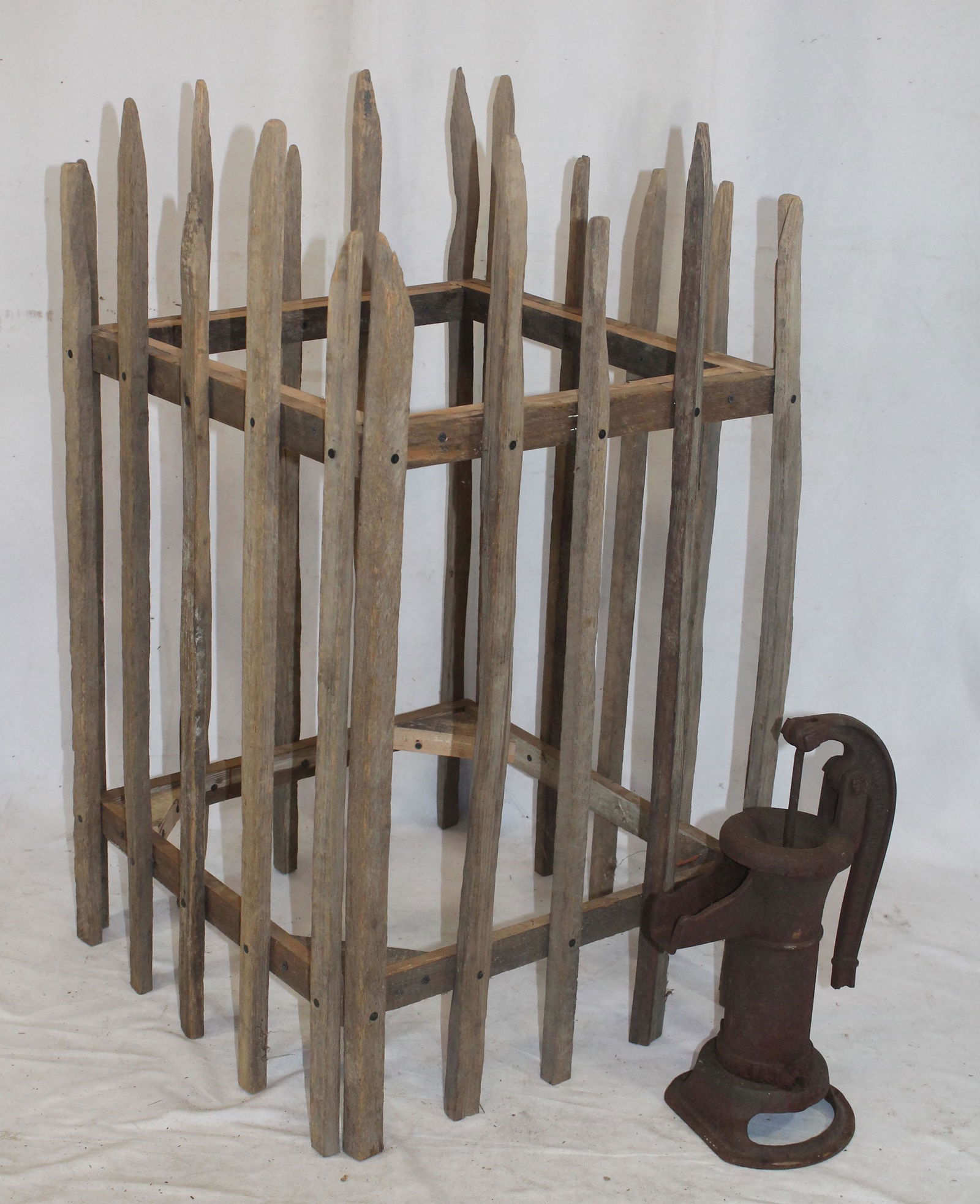 Wooden stake tree surround together w a cast iron well (1 of 3)