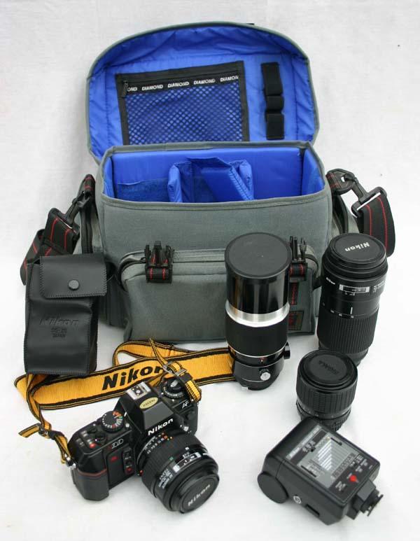 Nikon SLR camera in case w multiple lenses, speed: Nikon SLR camera in case w multiple lenses, speed light flash, etc