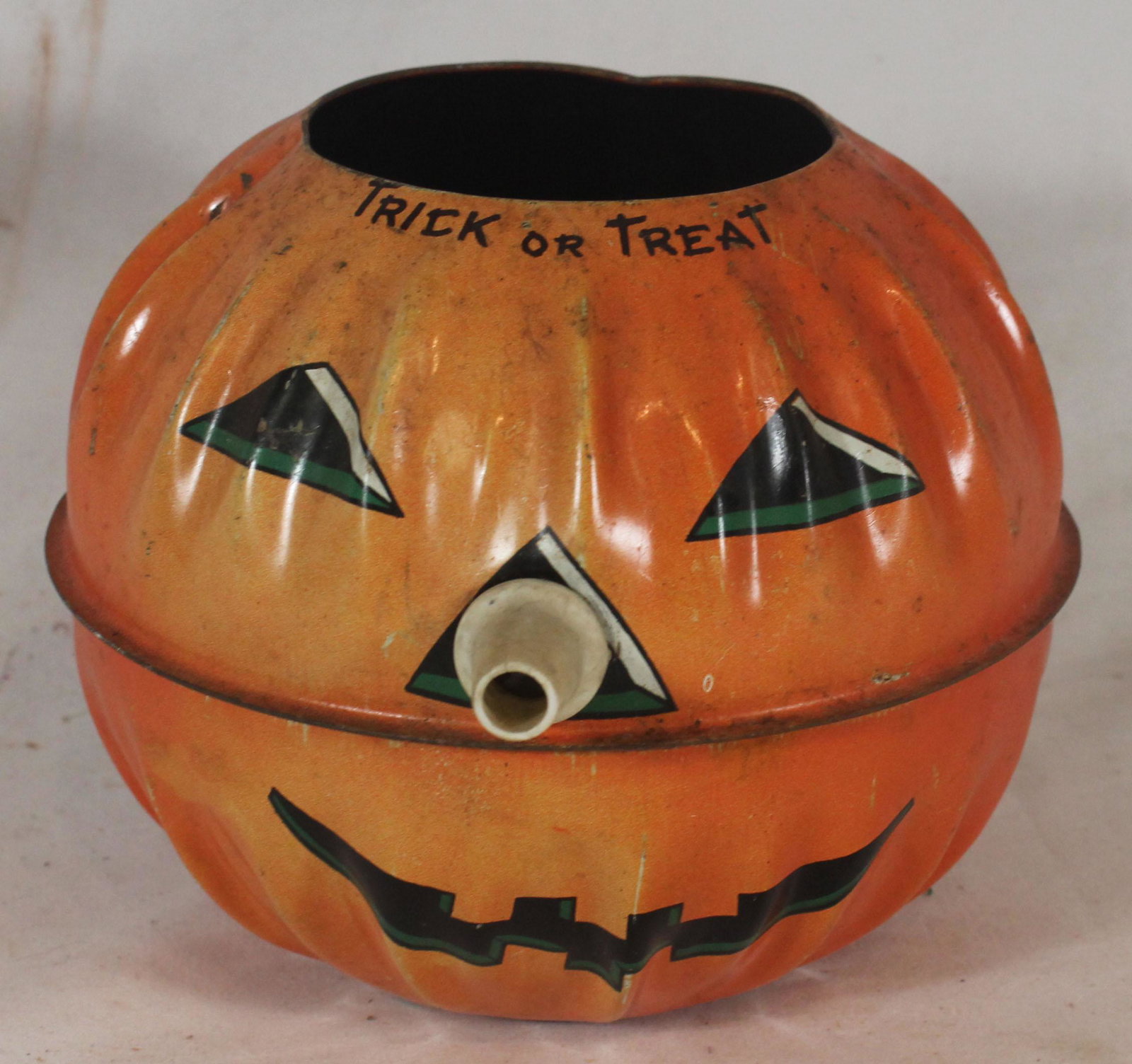 Tin pumpkin candy container - as found (1 of 4)
