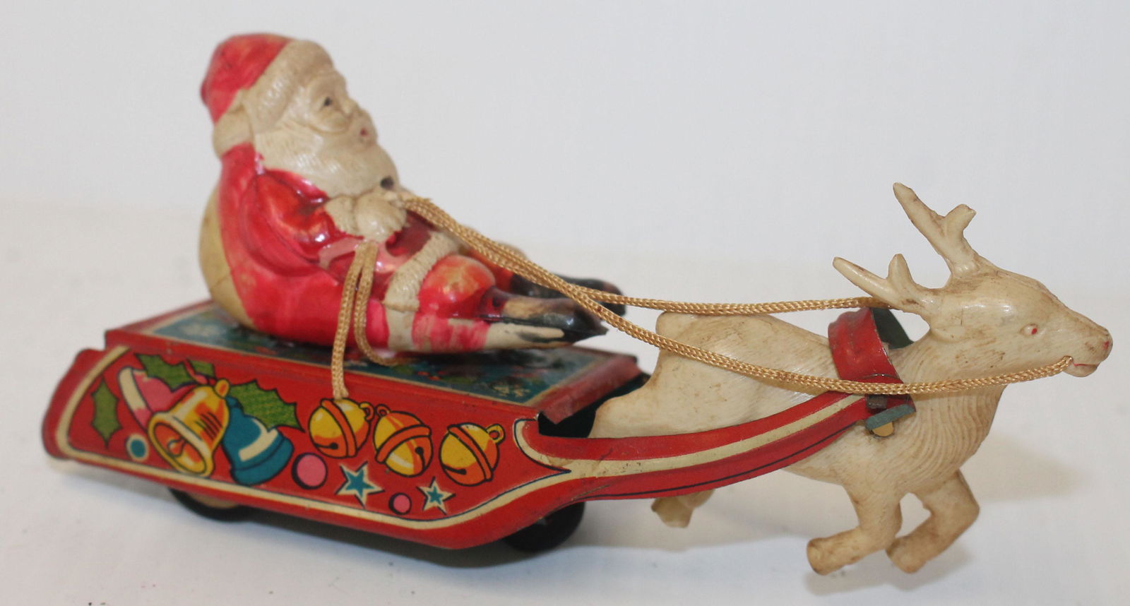 Japanese celluloid Santa on sleigh friction toy (1 of 3)