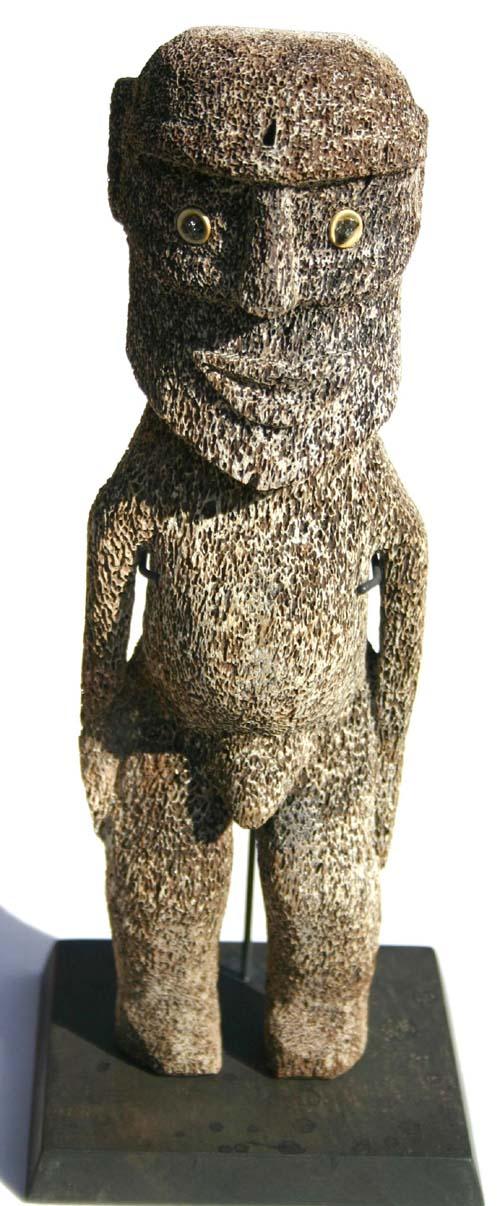 turn of the century carved whale bone Rapanui East: turn of the century carved whale bone Rapanui Easter Island figure w shark vertebrae & Obsidian eyes - 9 1/2" tall