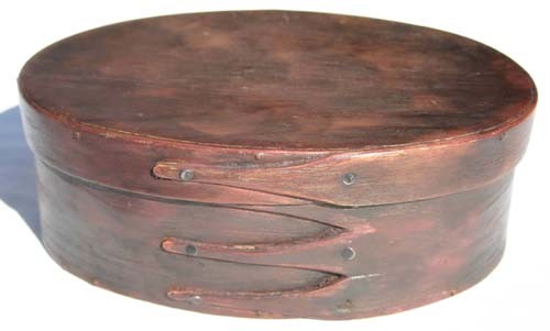 19thC oval finger lapped pantry box in old red pai: 19thC oval finger lapped pantry box in old red paint - 8 1/2" oval