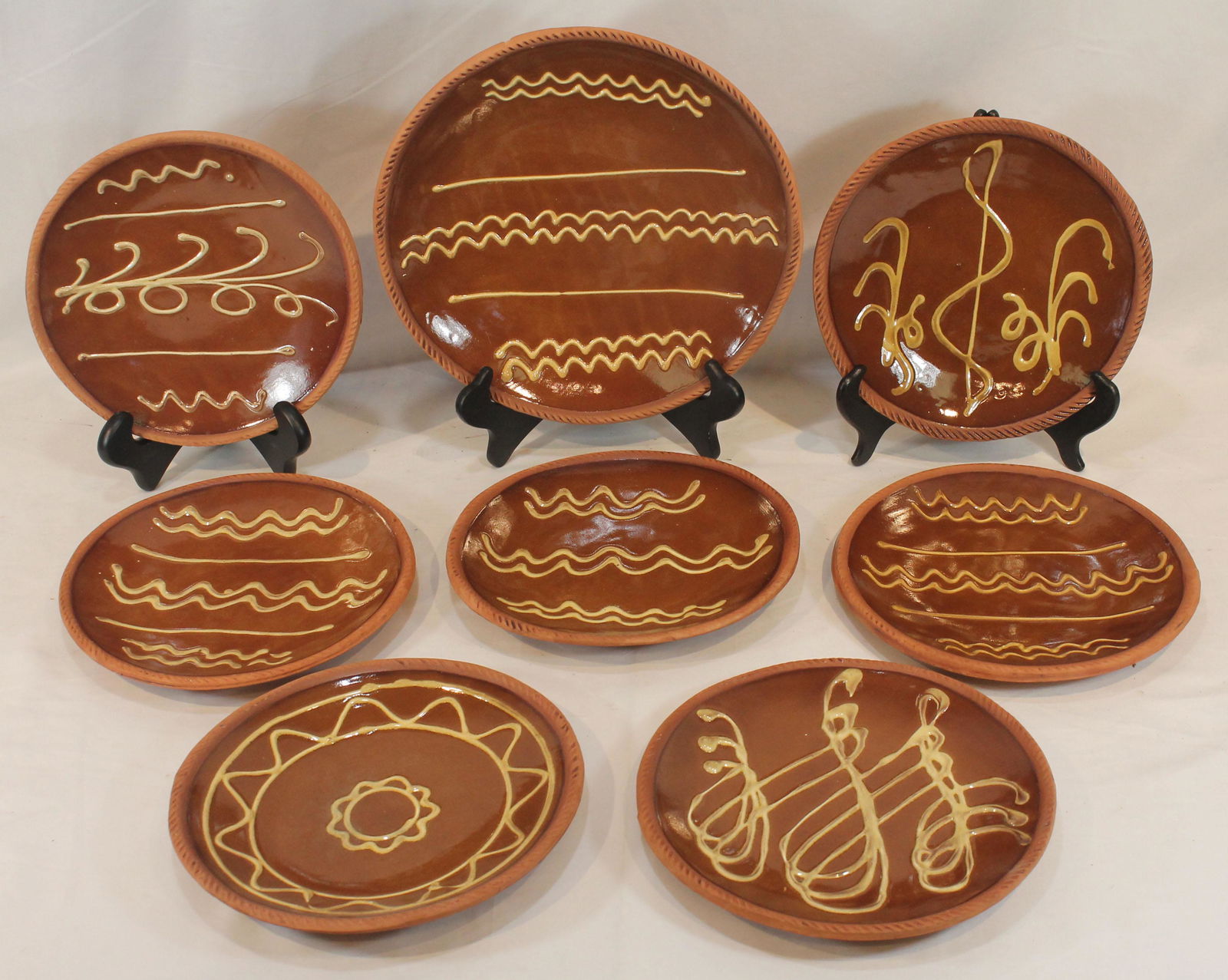 8 Old Sturbridge Village redware slip dec plates - seven are 9 1/2" diam & one 12" diam (1 of 8)