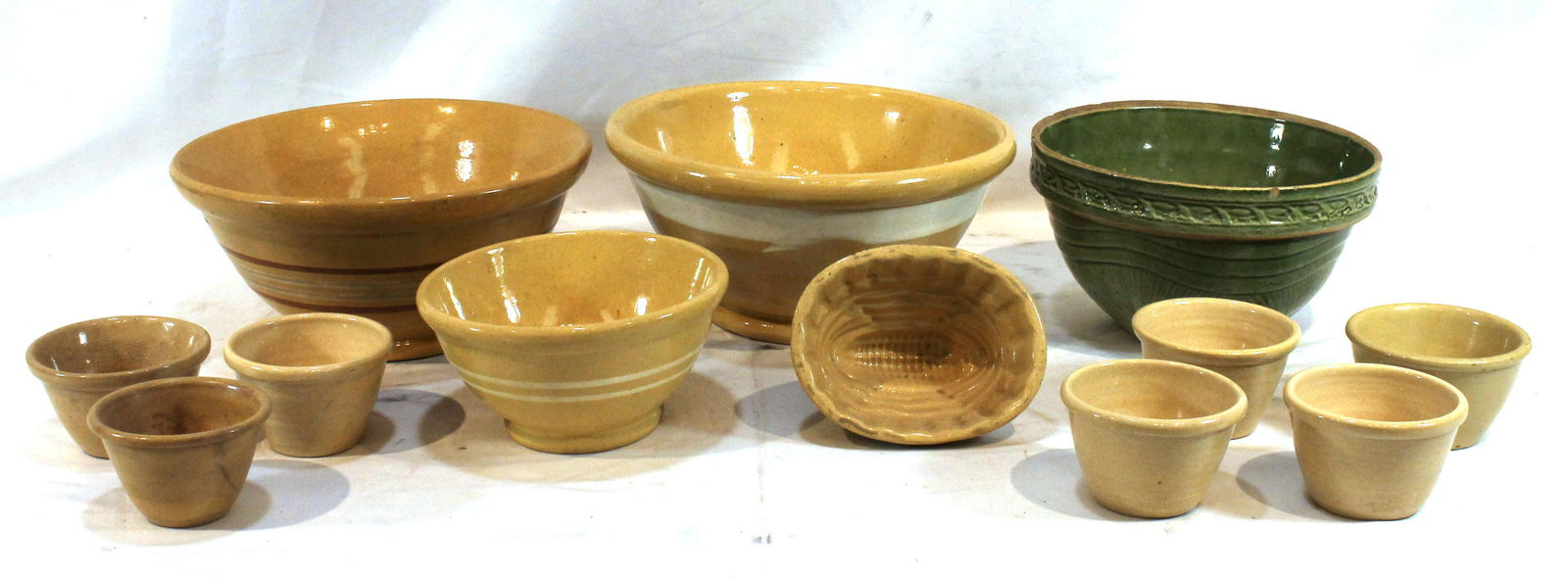12 pieces of misc yellowware - 10 1/2", 10 1/4", 8 3/4", 6 3/4" diam bowls plus 5 3/4" corn dec mold (1 of 9)