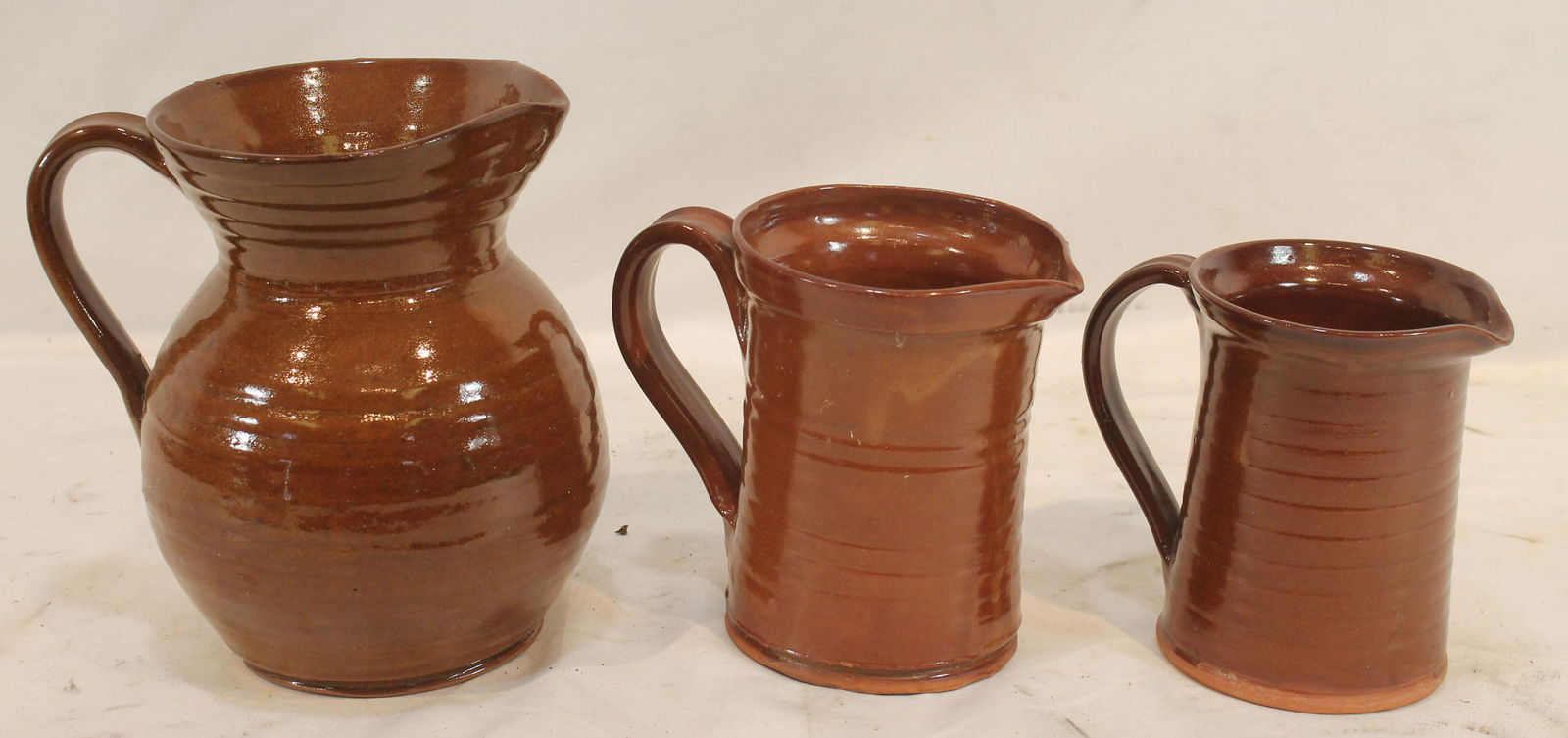 3 contemporary redware pitchers marked Old Sturbridge Village - 7", 5 1/4" & 5" tall (1 of 11)