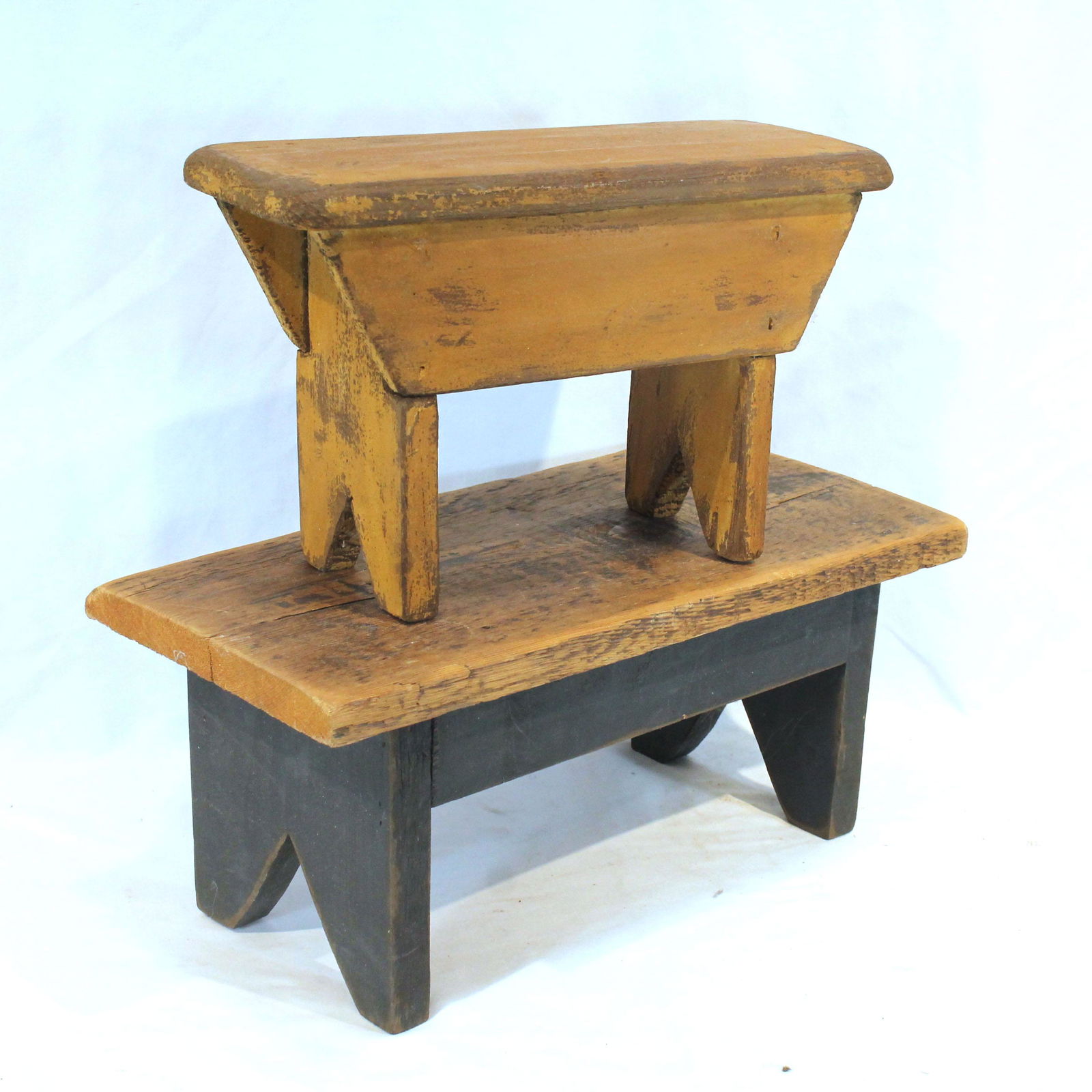 2 contemporary primitive style cricket stools in yellow & blue paint - 7" tall x 16" wide & 7" tall (1 of 3)