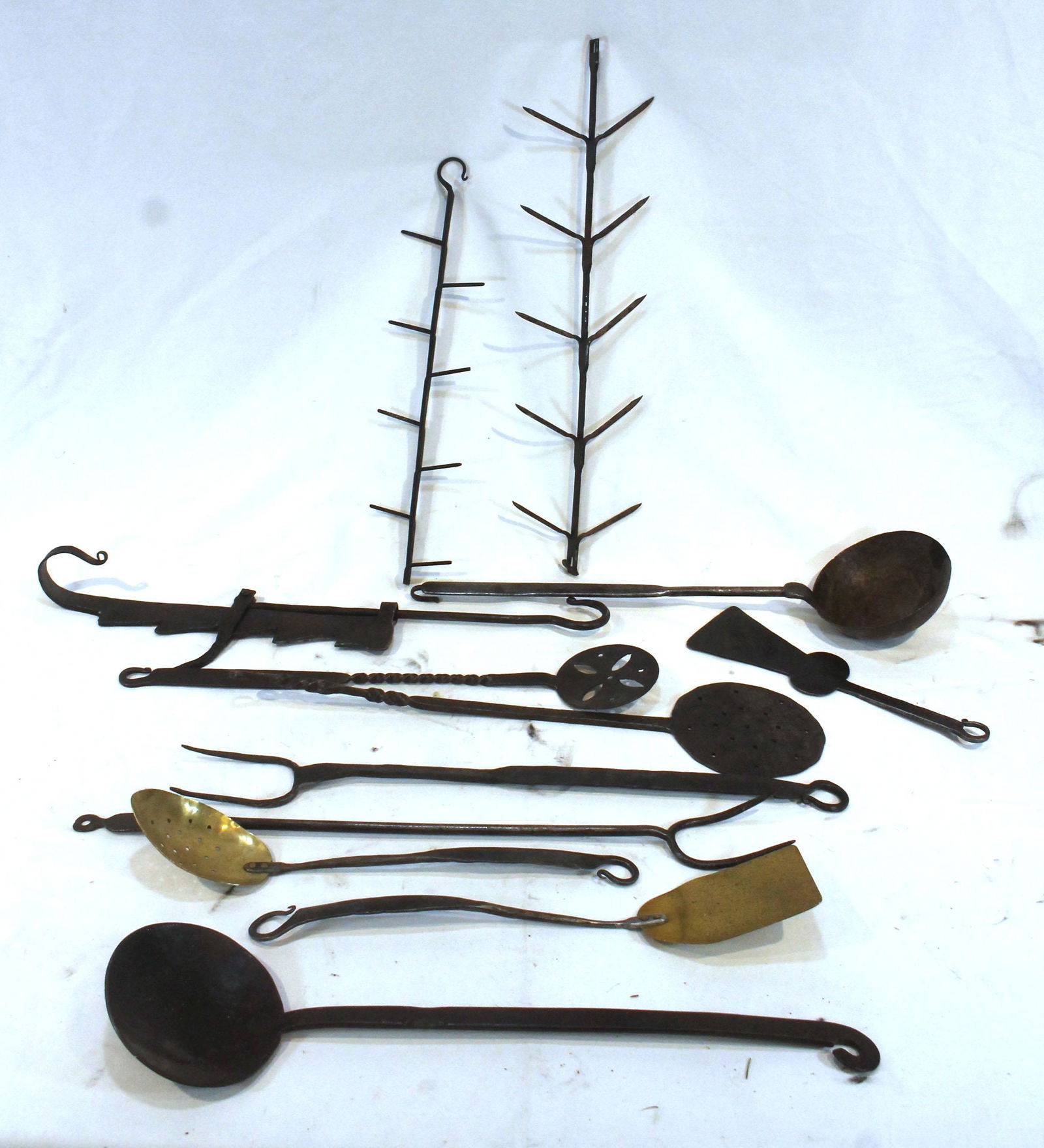 large lot of primitive style iron implements incl trammel, corn driers, strainers, ladles, forks, (1 of 7)