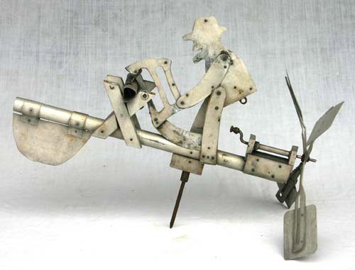 1930's folk art sheet metal whirligig of a man saw: 1930's folk art sheet metal whirligig of a man sawing -