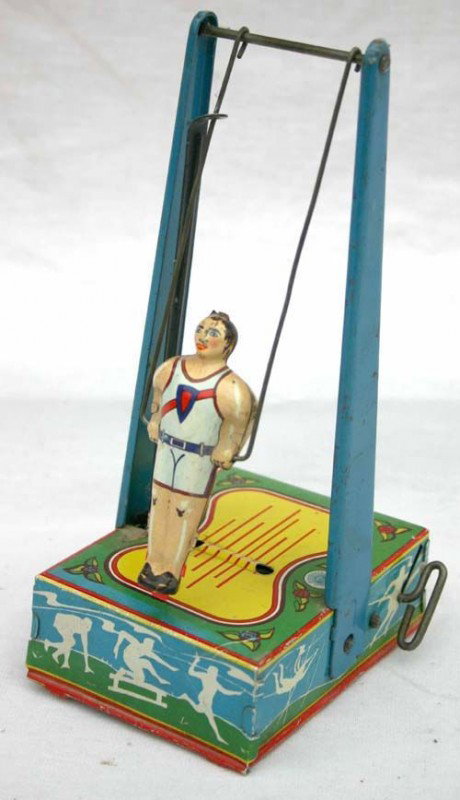 Wyandotte gymnast tin wind up - 9" tall: Wyandotte gymnast tin wind up - 9" tall