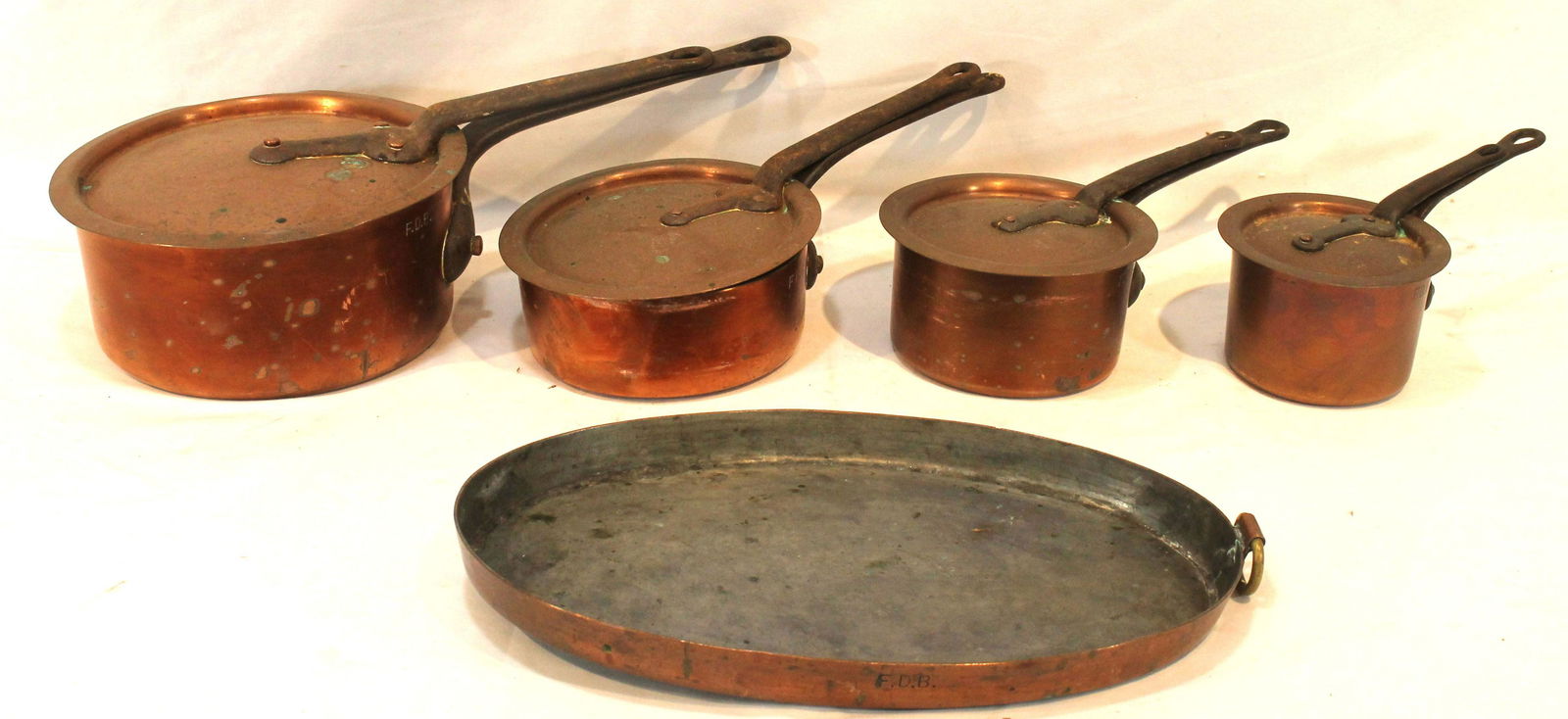 Graduated set of 4 copper pots w lids marked Duparquet New York & FDB plus a copper oval shallow
