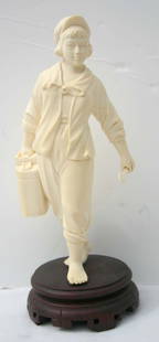 Chinese Cultural Revolution ivory carved figure of: Chinese Cultural Revolution ivory carved figure of a girl w jerry can in one hand & a wrench in the other - in orig box - overall height 7" tall